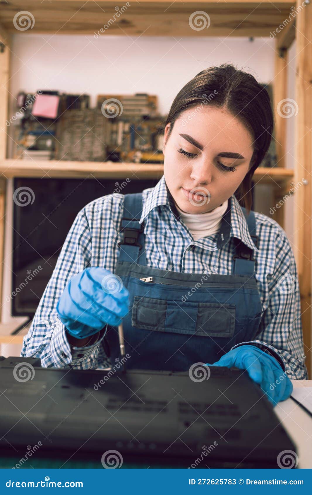 Computer Repair Shop. Engineer Performing Laptop Maintenance Unscrew