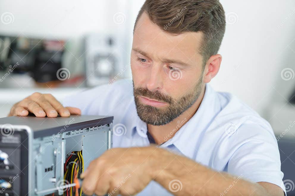 Computer Repair Technician Working on Pc with Tools Stock Photo Image