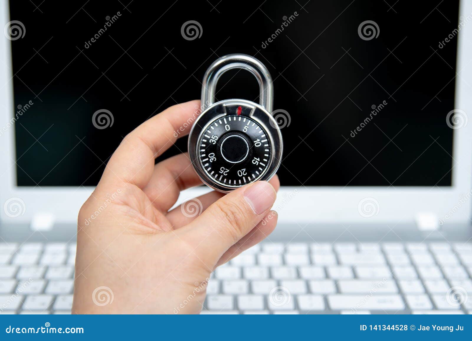 Computer Security Concept, Padlock on Laptop Keyboard. Stock Photo