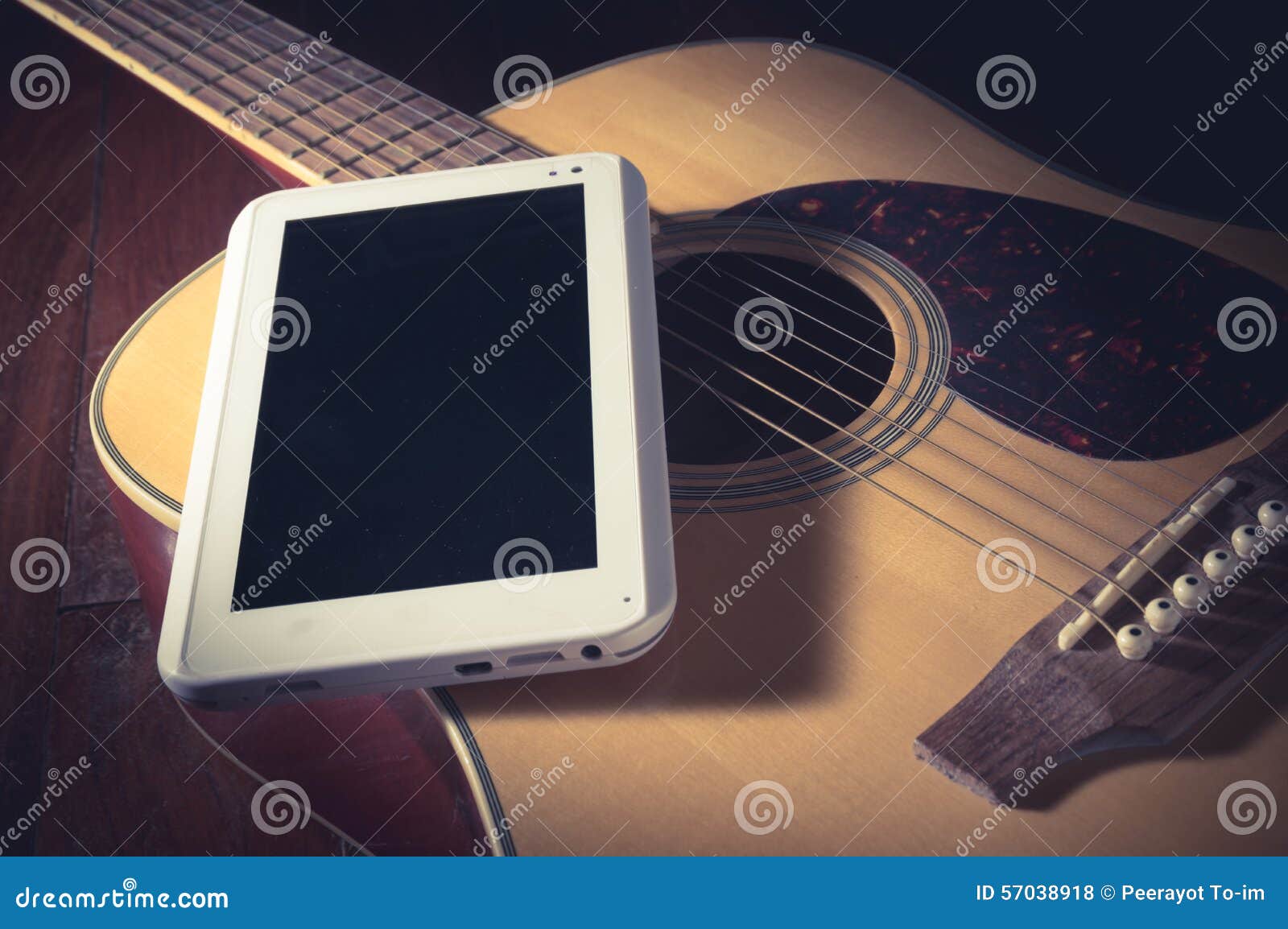 Computer tablet on guitar. stock photo. Image of karaoke 57038918