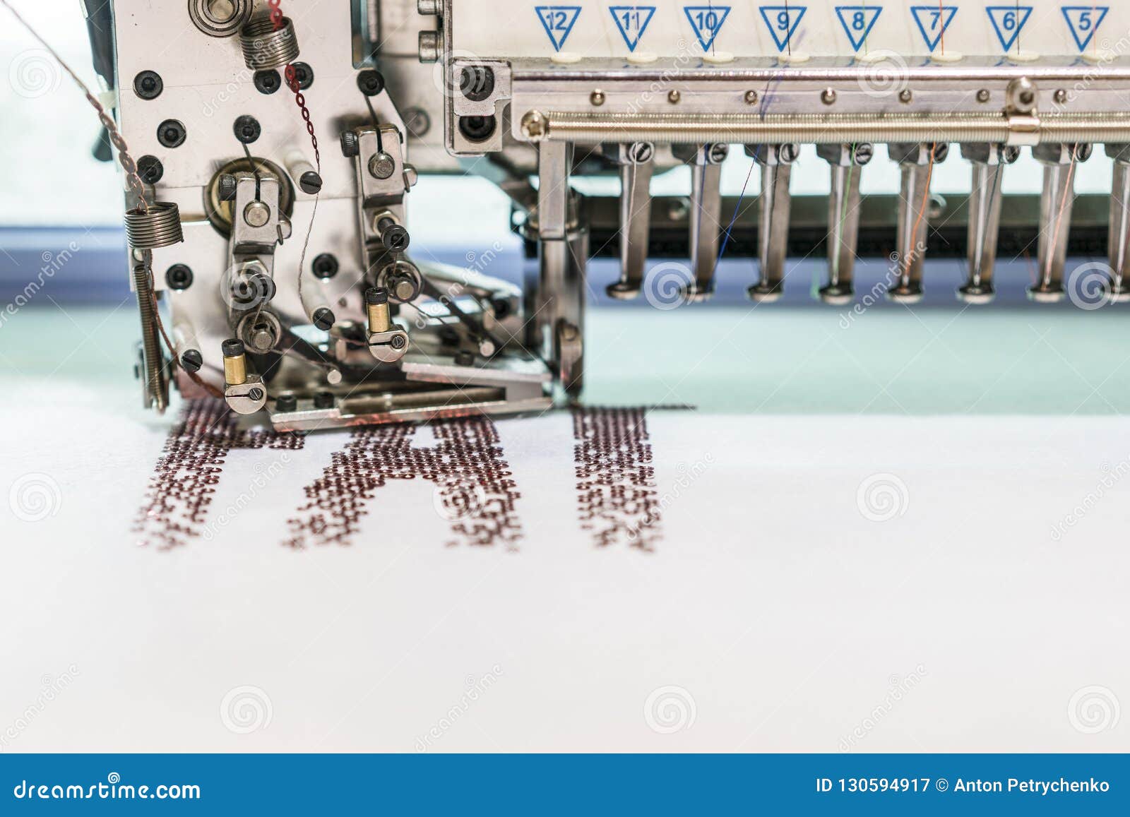 Computerized Embroidery Machines. Sewing Machine on Blurred Background