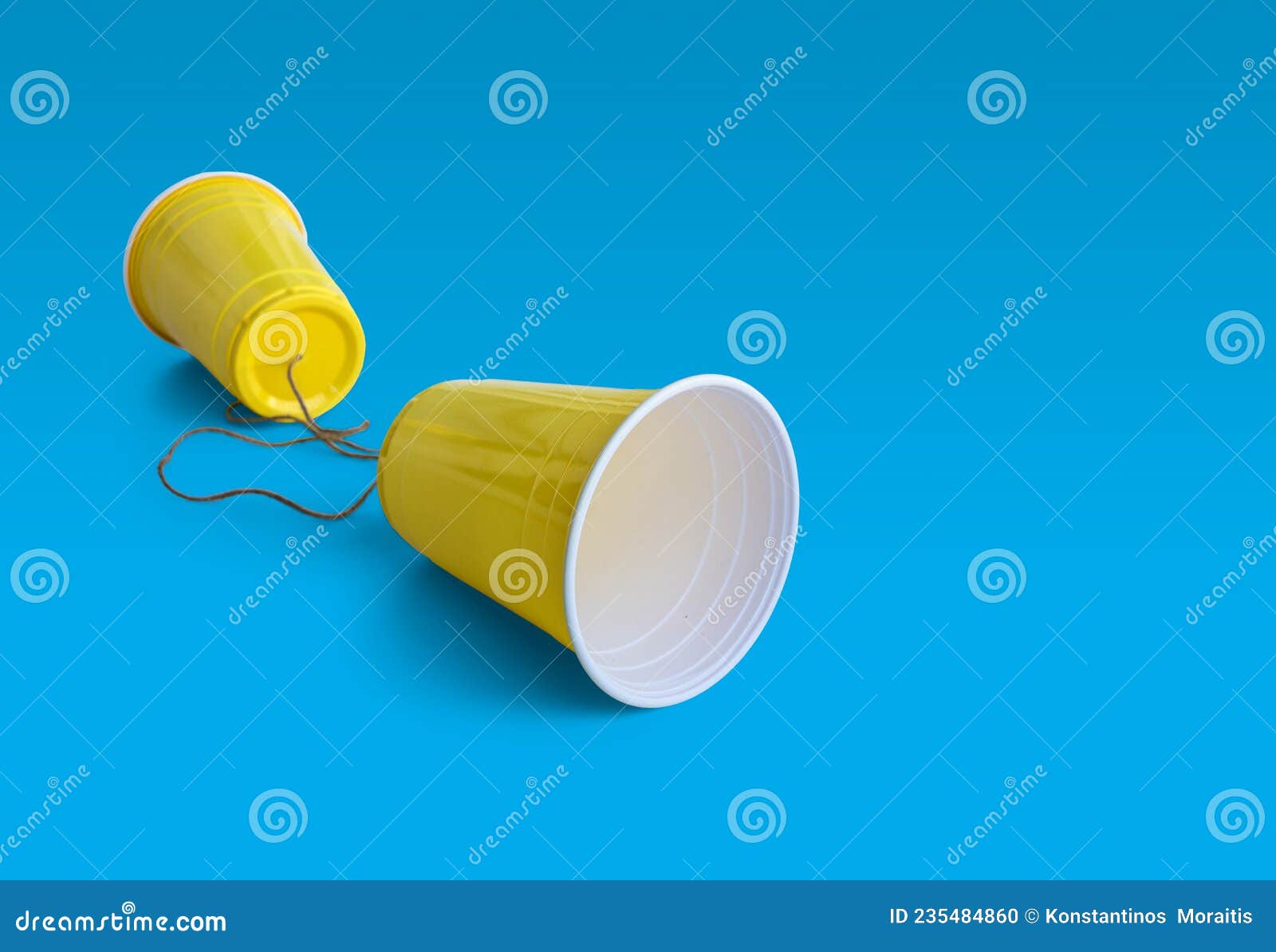 comunication yellow plastic cup with string