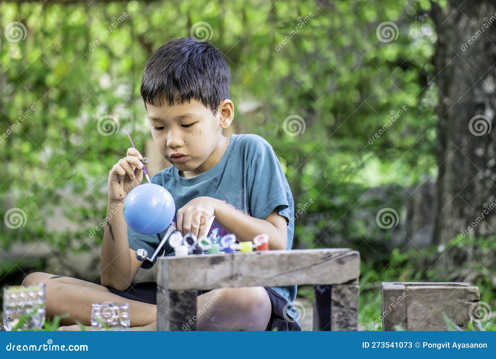 Concentrated Asian Boy Coloring Solar System Toys, Sensory Activity, Learning Tools at Home