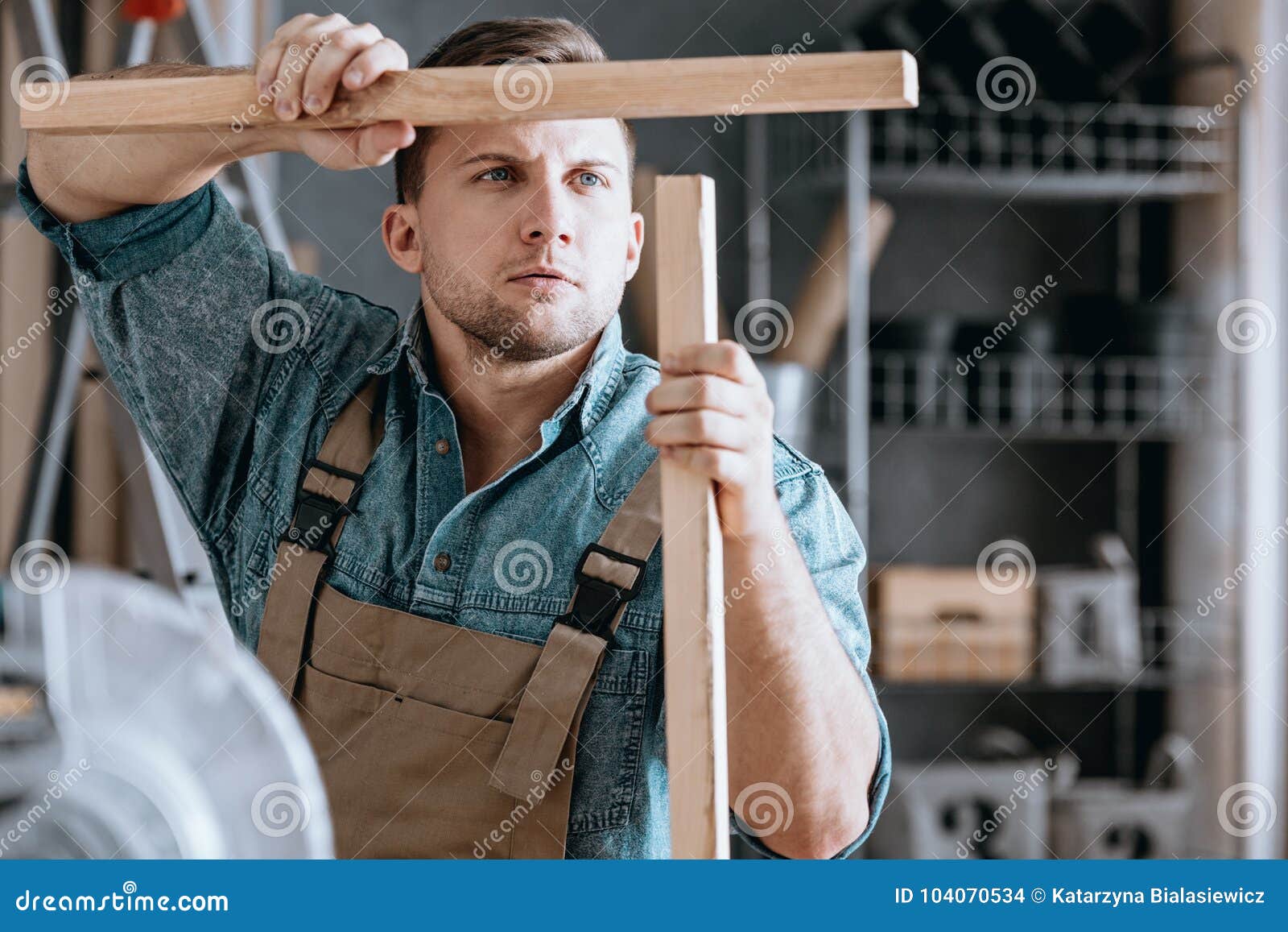 concentrated carpenter matching wooden parts