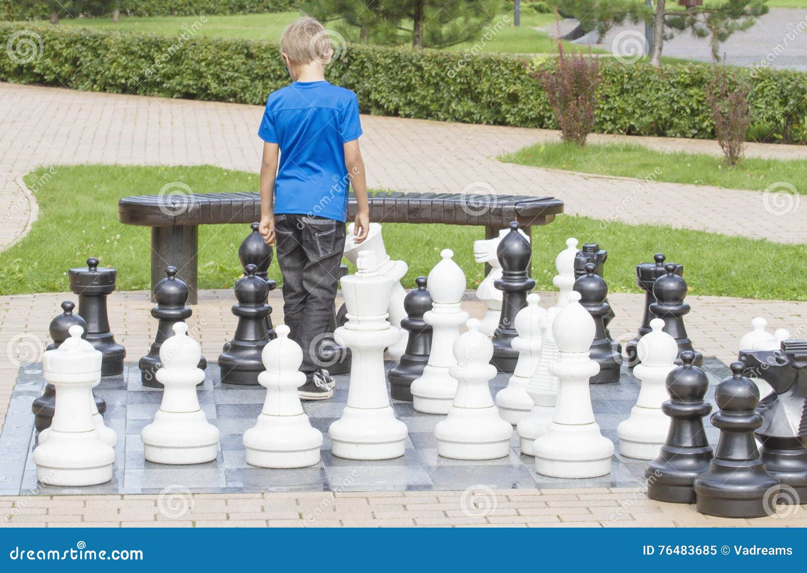 Children's Restraining Hand Thoughtfully Figure Before The Next Chess Move  Stock Photo, Picture and Royalty Free Image. Image 77247675.