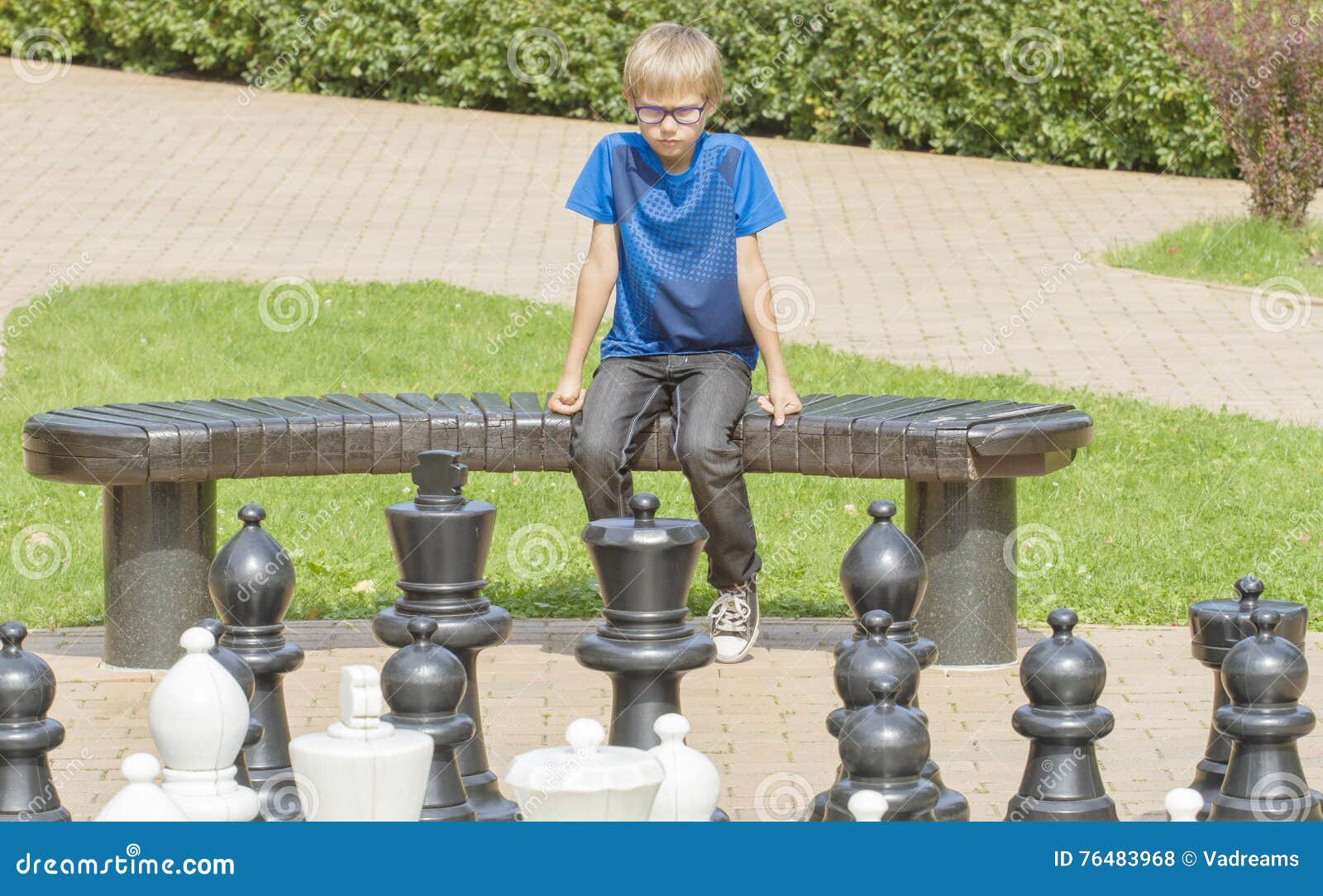 Children's Restraining Hand Thoughtfully Figure Before The Next Chess Move  Stock Photo, Picture and Royalty Free Image. Image 77247675.