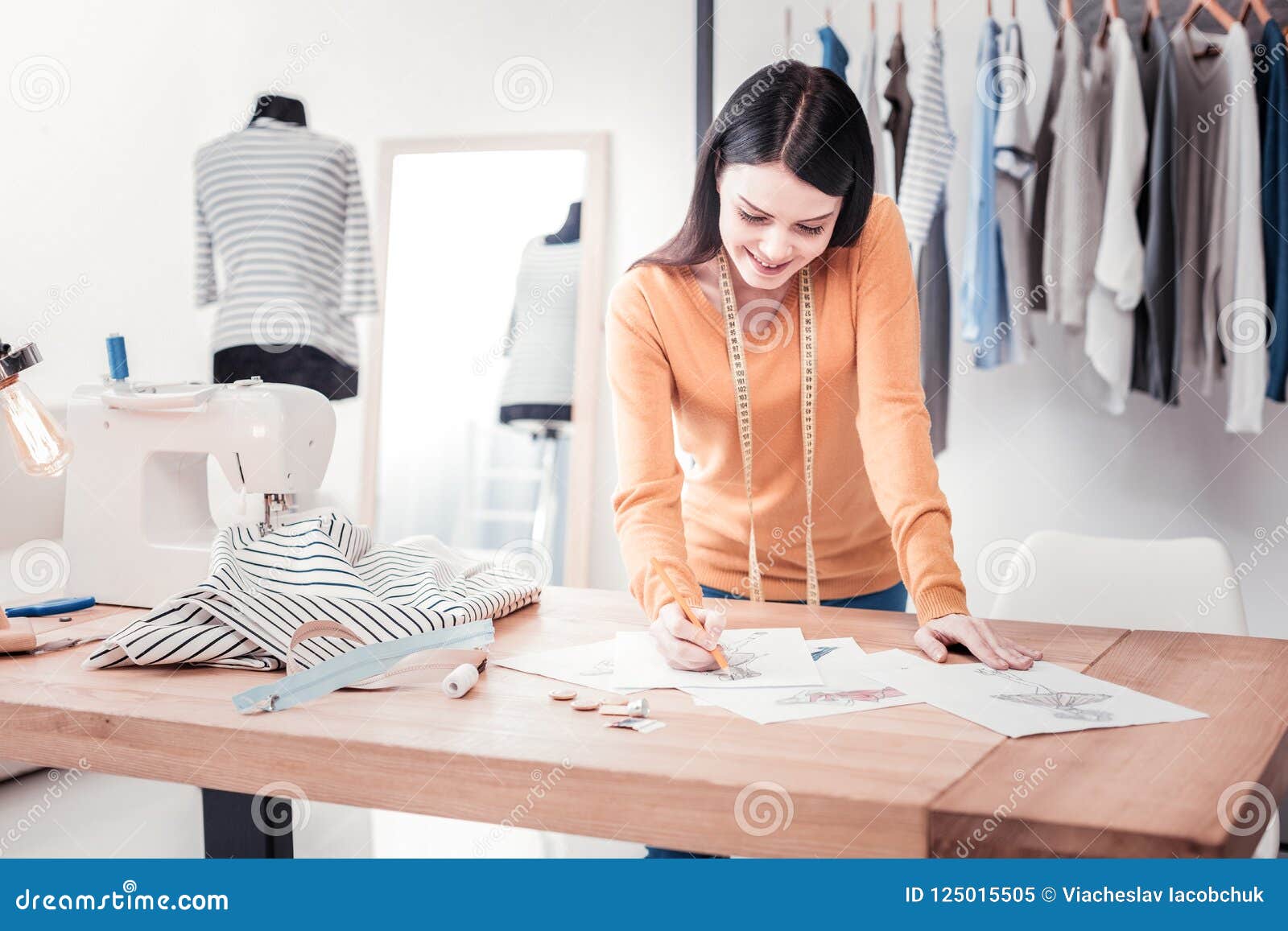 Concentrated Designer Creating New Drafts with Clothes Stock Image ...