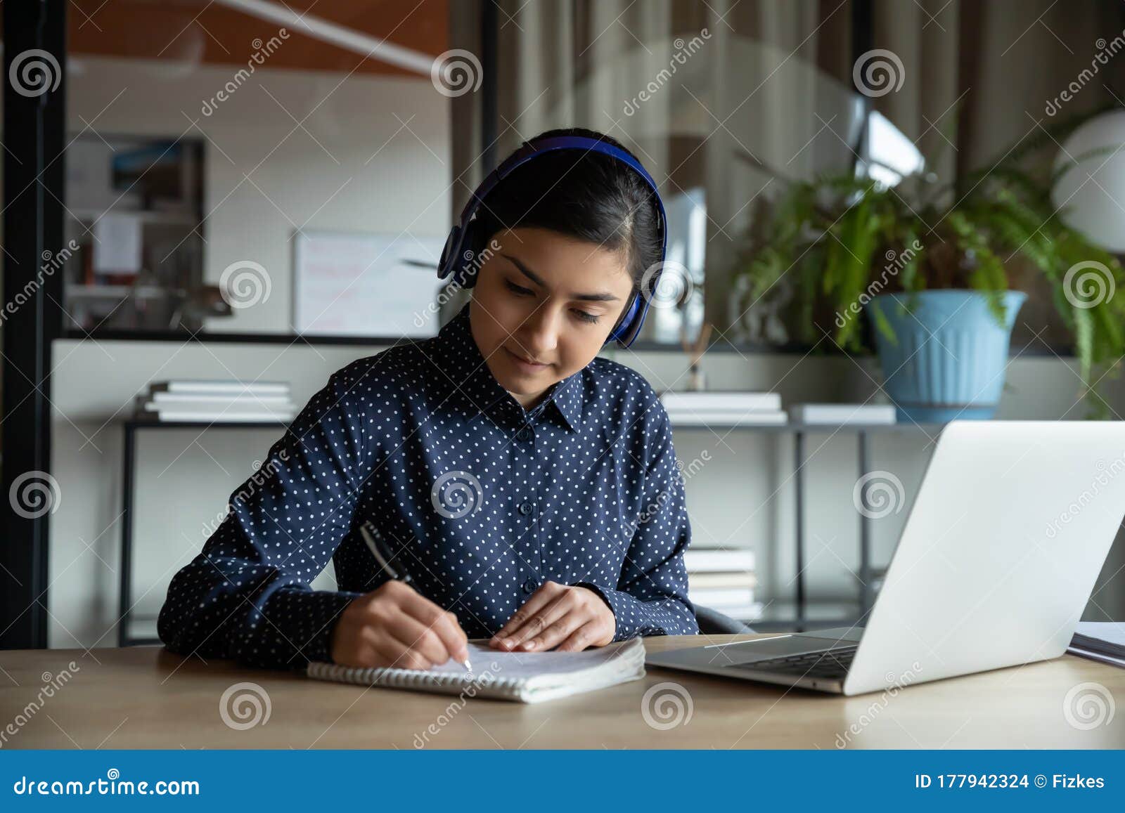 concentrated female student studying remotely on online courses.