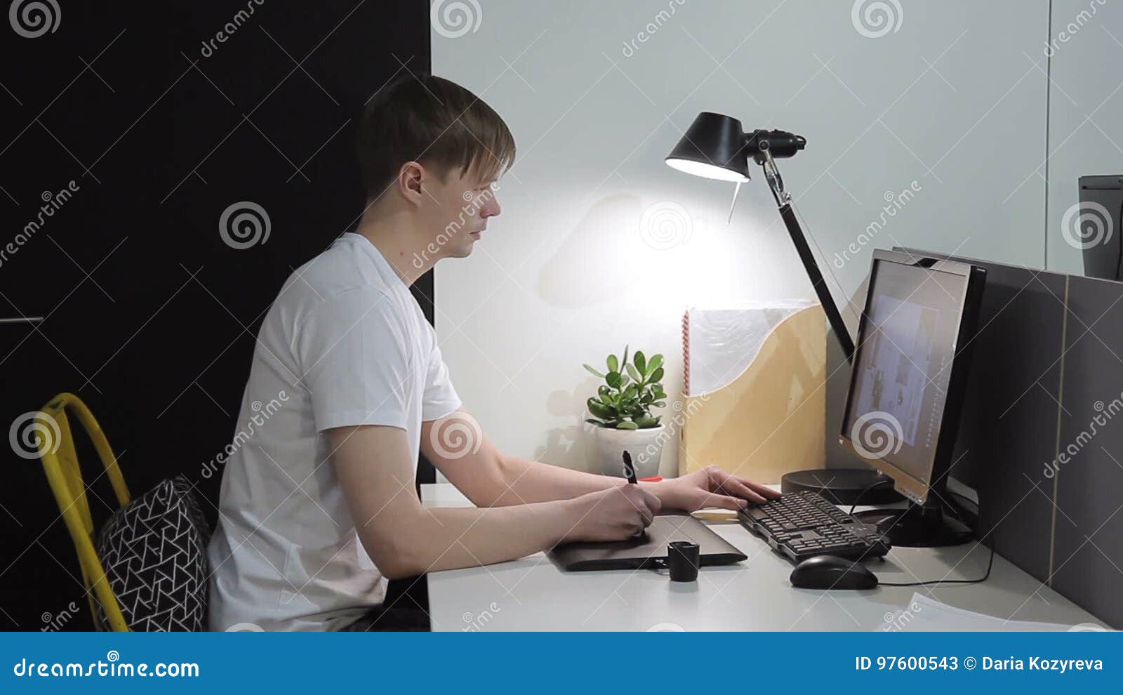 Concentrated Professional Office Worker Man Manager Doing Analysis Job Sit Under Lamp Indoors Sitting In Chair