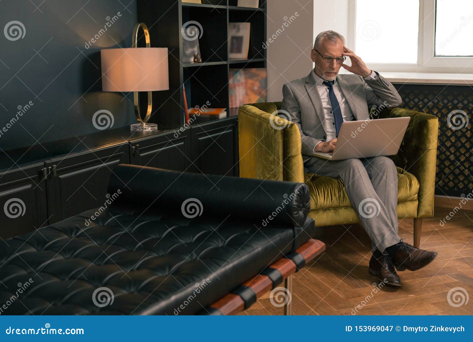 Concentrated Serious Gray Haired Man Sitting In An Armchair Stock Image Image Of Couch