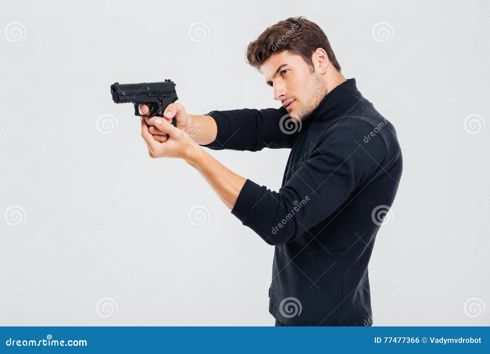 Holding a pistol with two hands