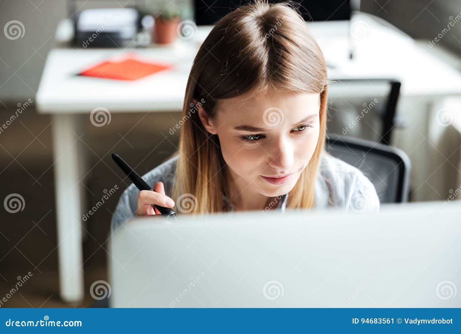 Concentrated Young Woman Work in Office Using Computer Stock Image