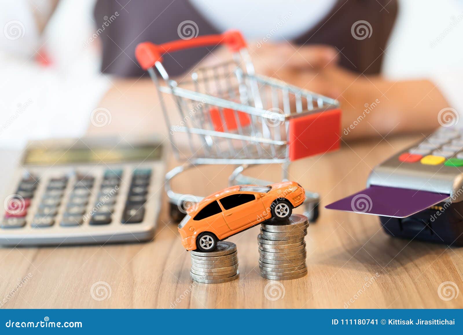 concept of buying new car by money with red shopping cart car buying calculator
