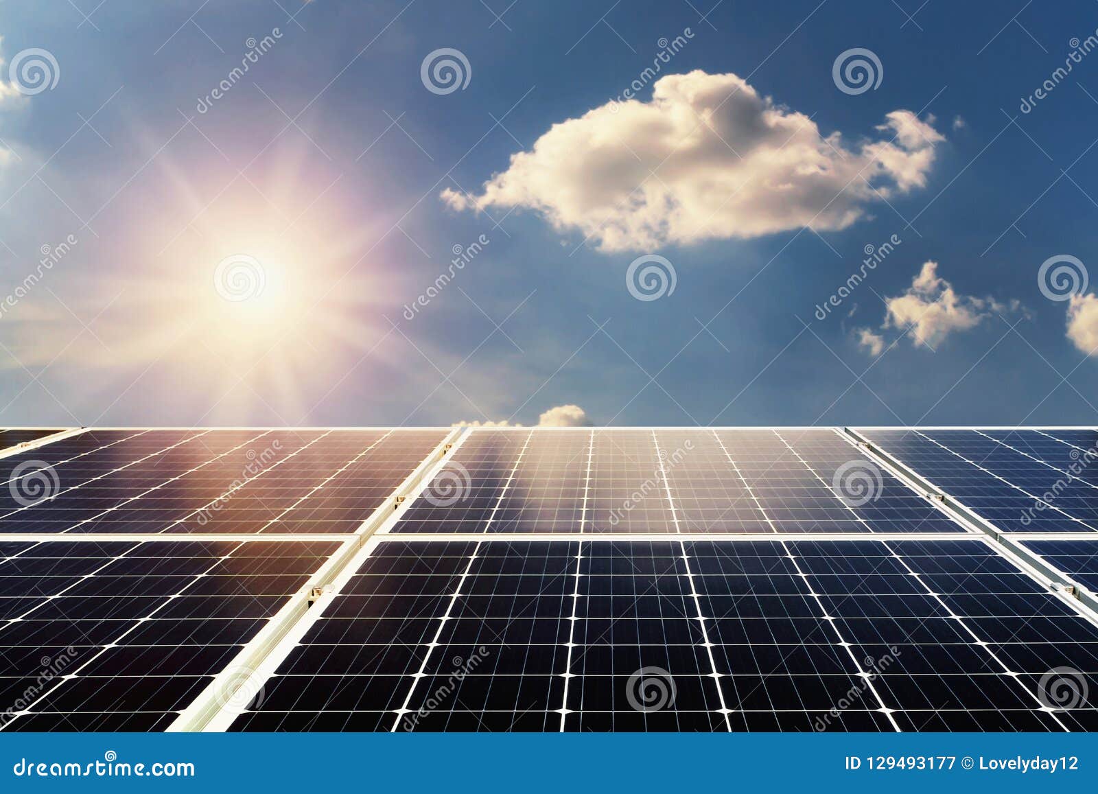 Concept Clean Power Energy. Solar Panel and Sunlight with Blue S Stock