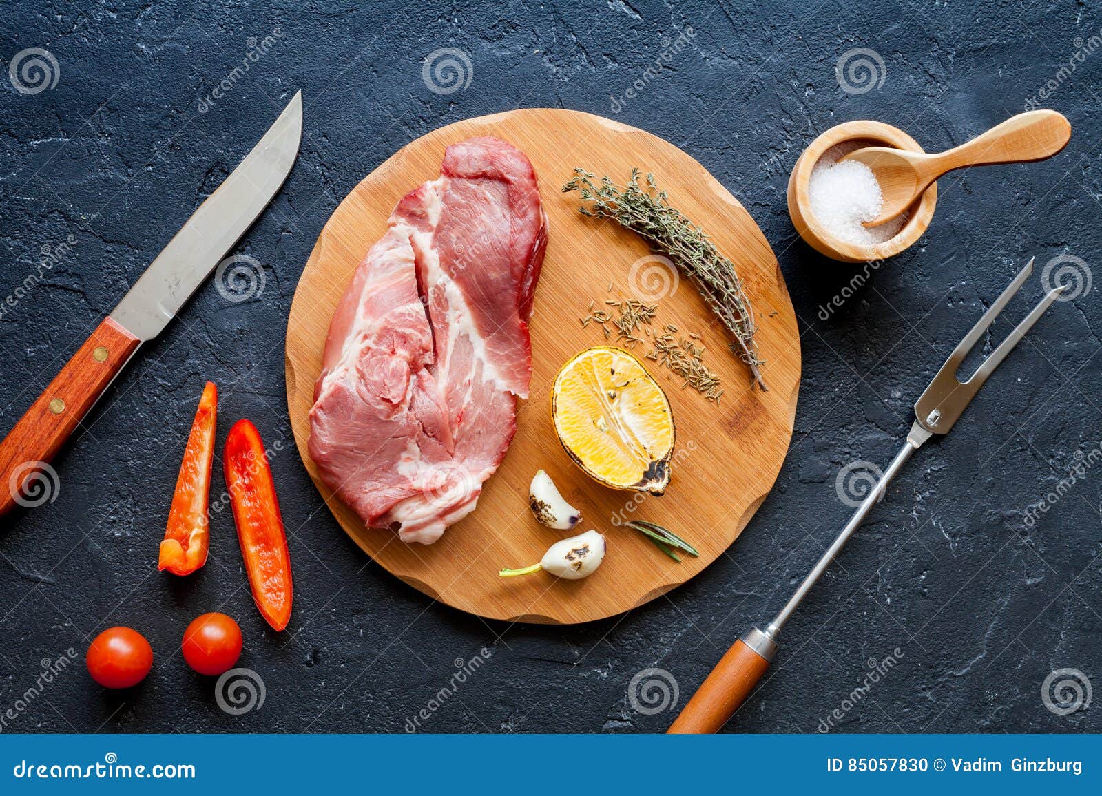Concept Cooking Meat Steak on Dark Background Top View Stock Photo