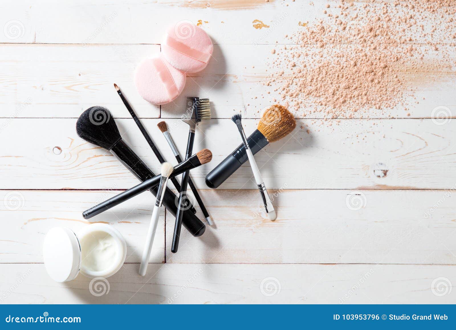 concept of cosmetics and makeup with powder, skincare and brushes