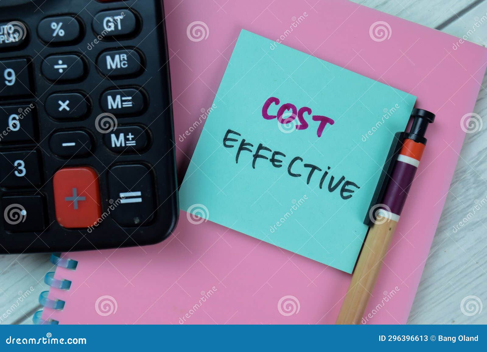 Concept of Cost Effective Write on Sticky Notes Isolated on Wooden