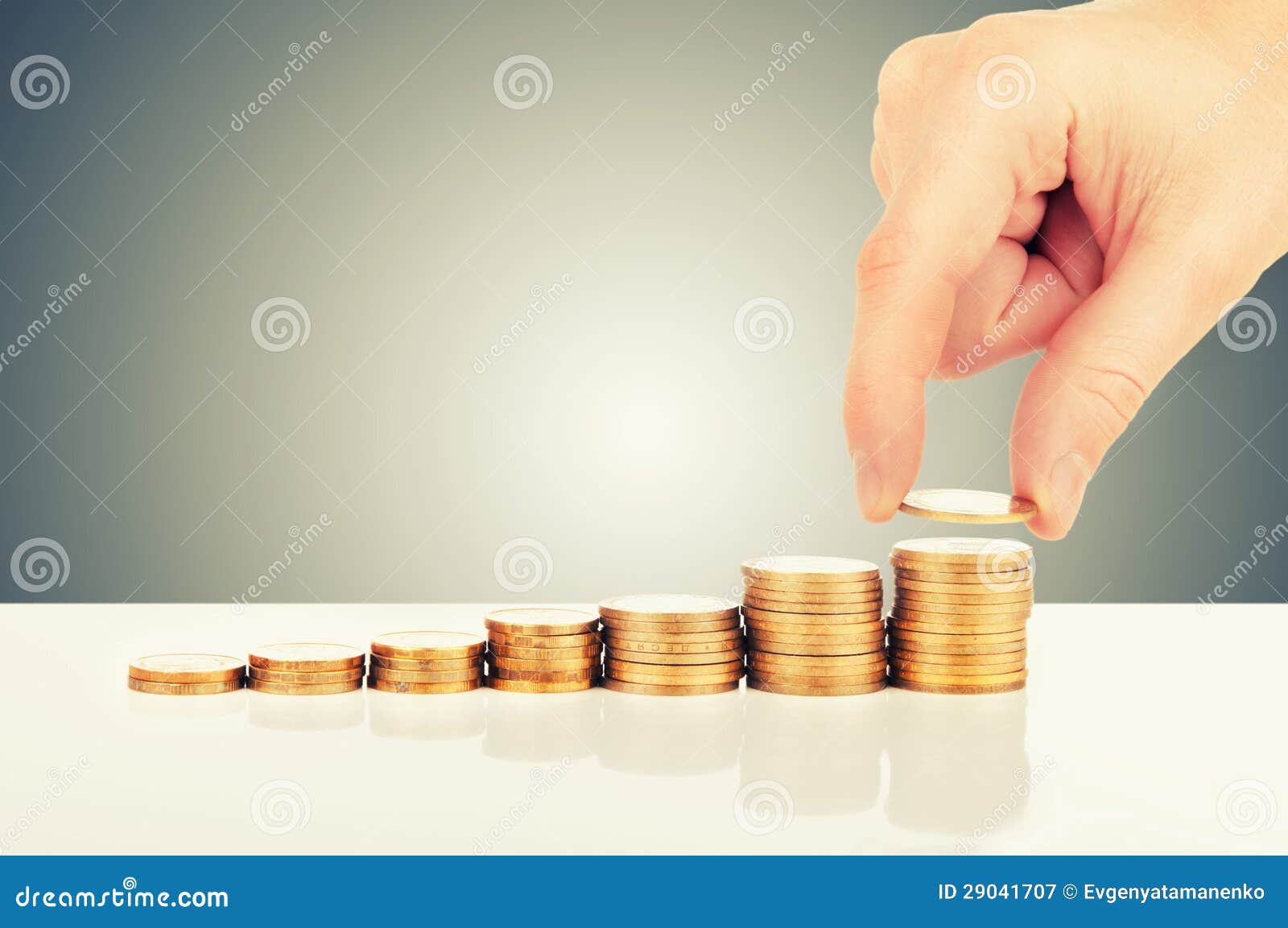 concept of financial growth. hand and gold coins