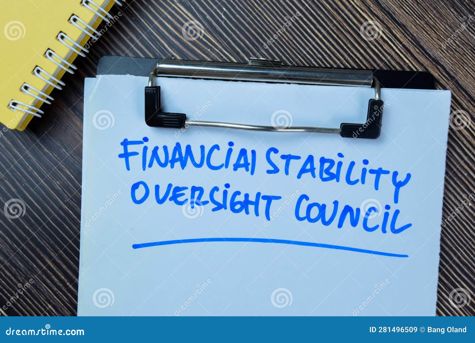 concept of financial stability oversight council write on paperwork  on wooden table