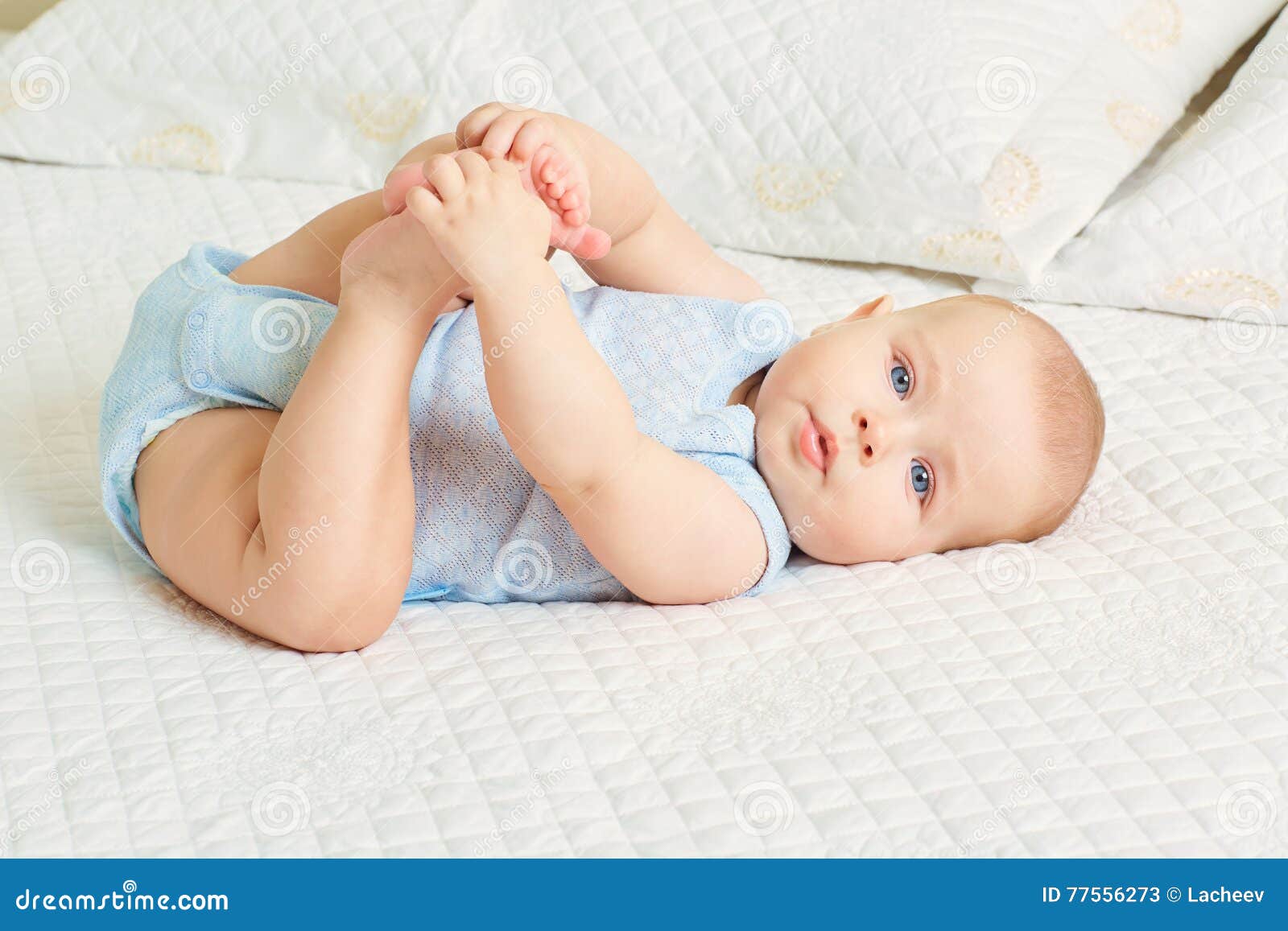 The Concept of a Healthy Child. Cute Baby Boy with Blue Eyes Lying ...