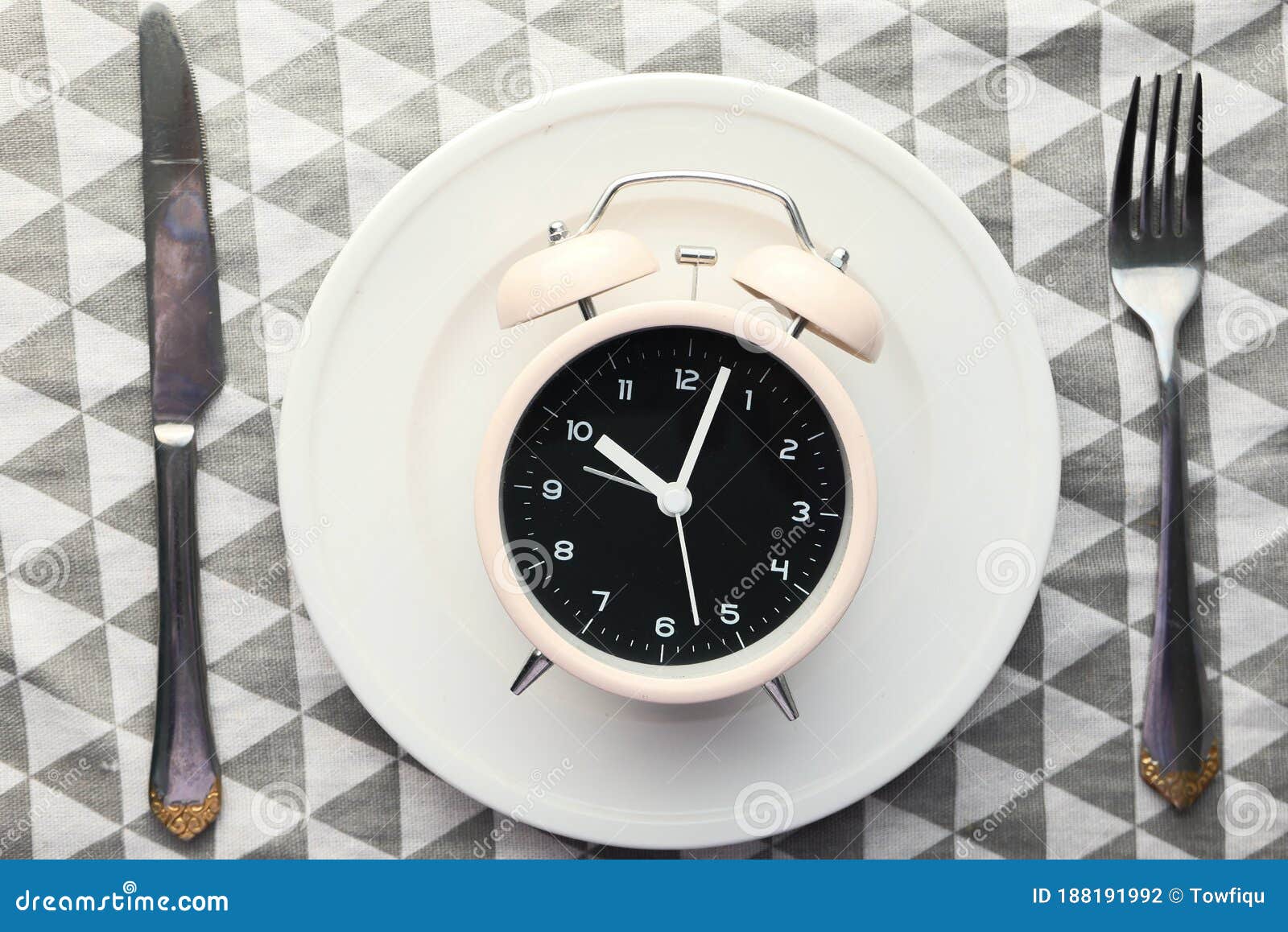 The Concept of Healthy Food, Alarm Clock on Plate Stock Photo Image