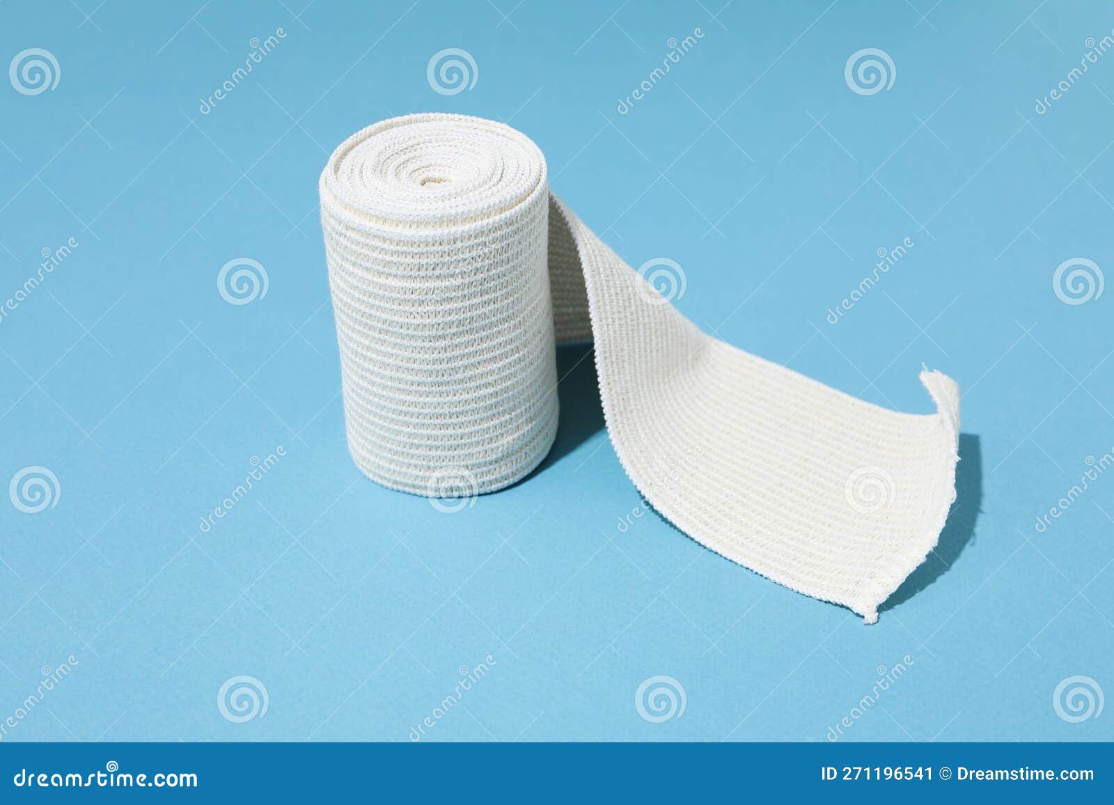 Concept of Help during an Injury, Elastic Bandage on Blue Background