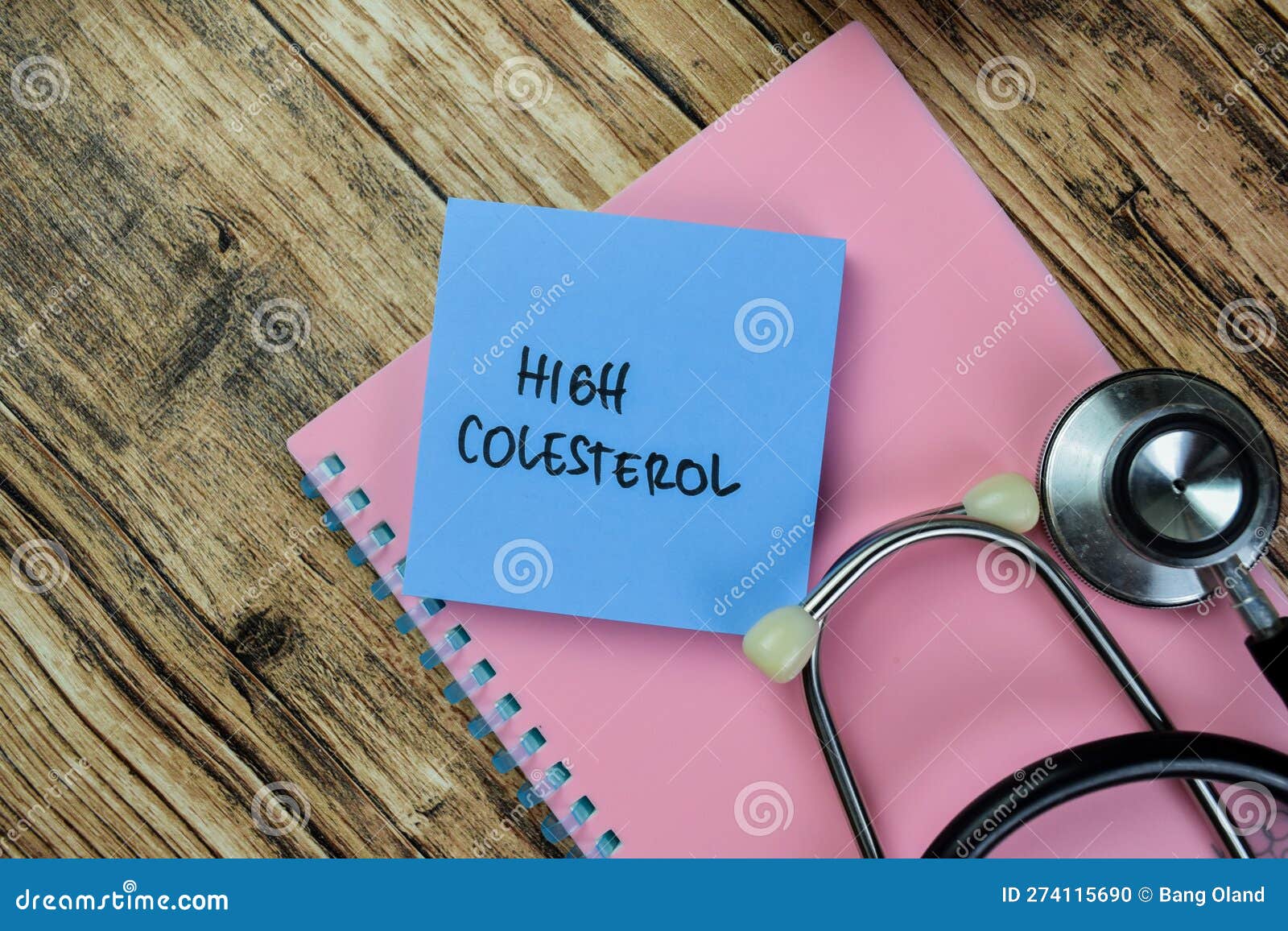 concept of high colesterol write on sticky notes with stethoscope  on wooden table