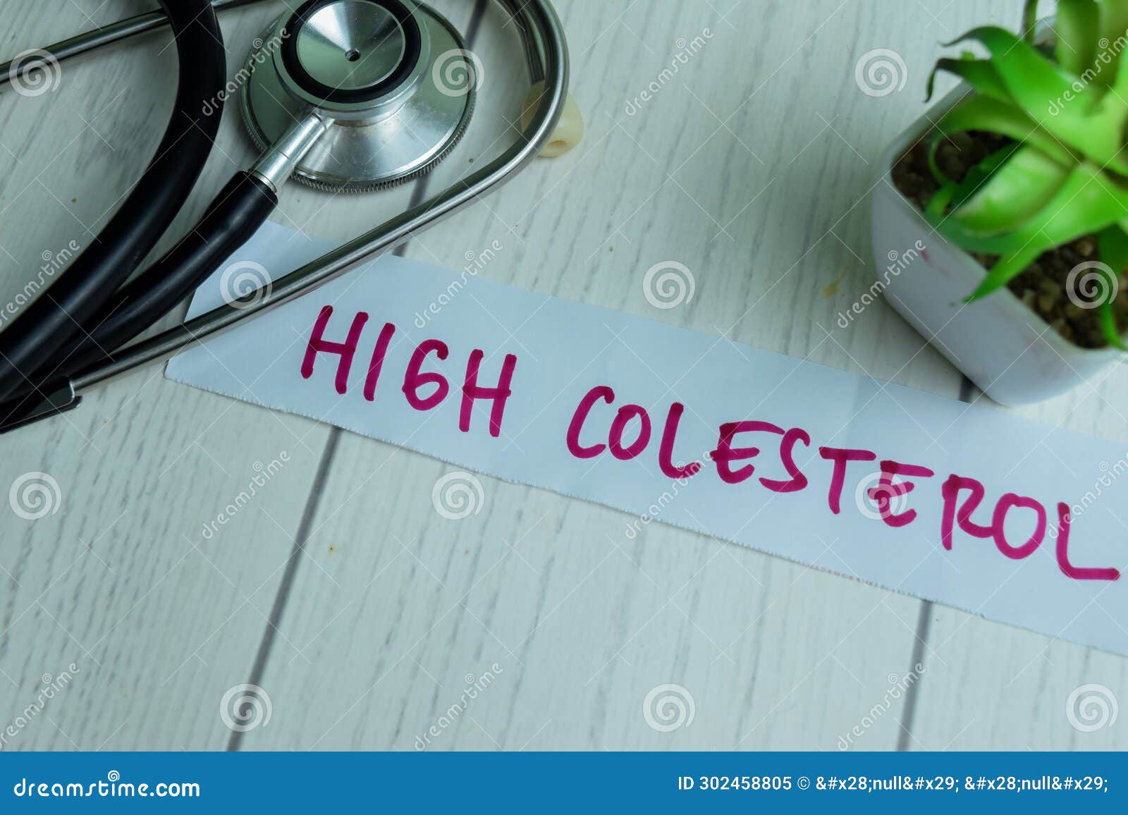 concept of high colesterol write on sticky notes with stethoscope  on wooden table