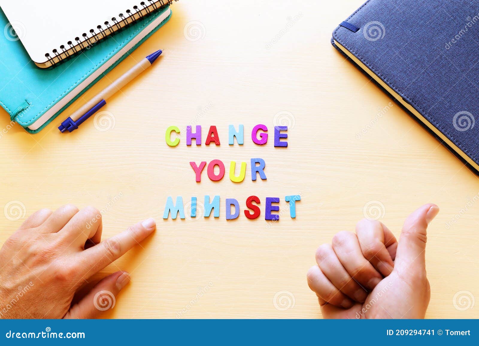 concept image with change your mindset text. top view of office table