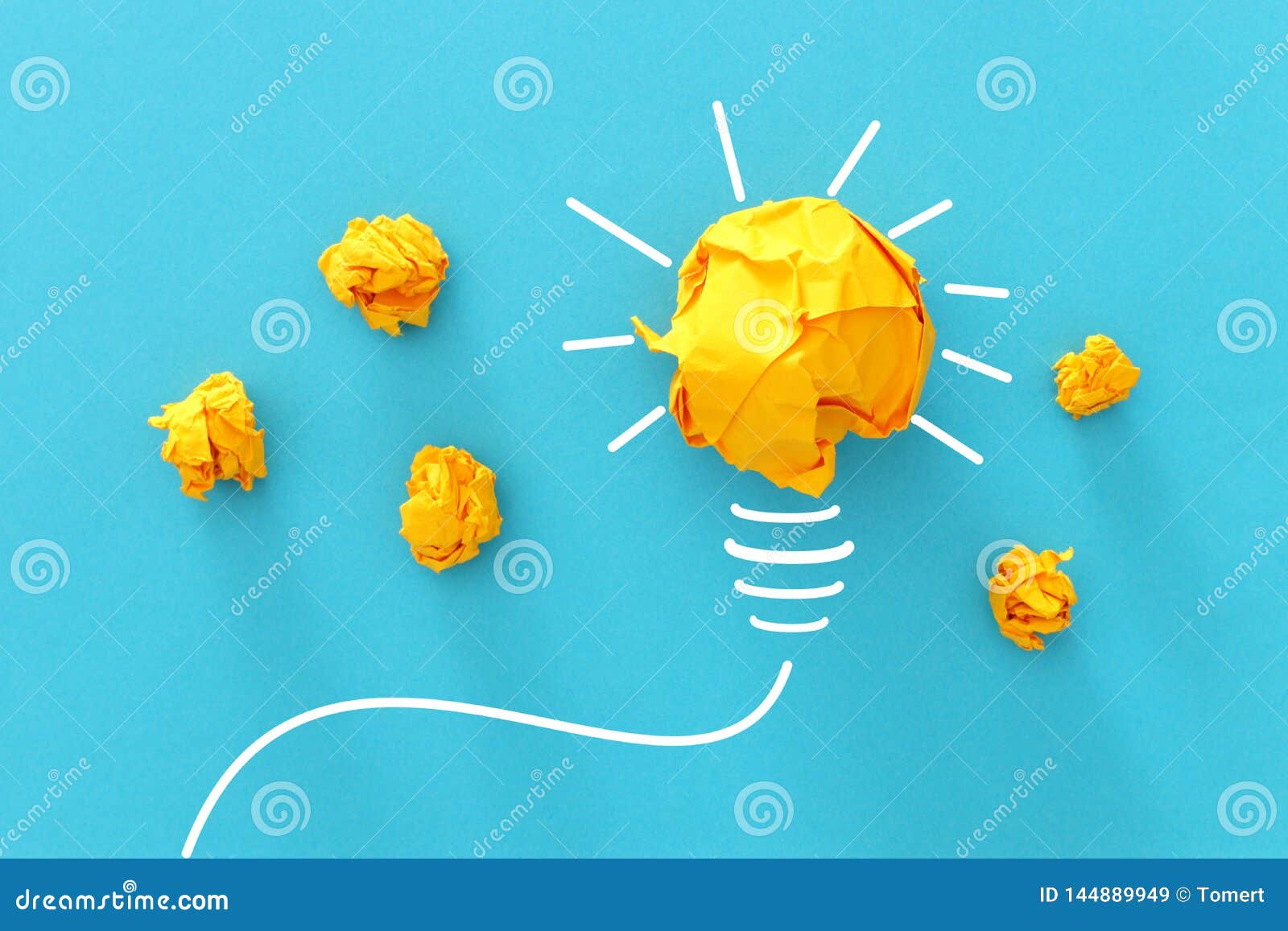 concept image of successful idea, crumpled paper and light bulb sketch, brainstorming and creative thinking