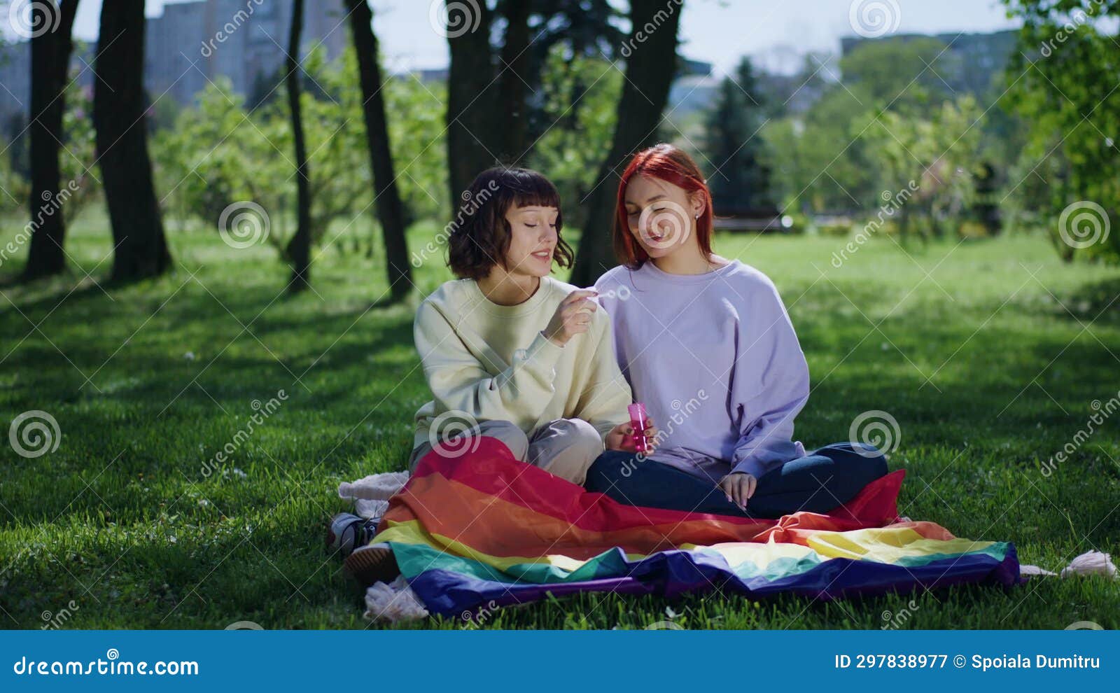 Concept Of Lgbt Community Lesbian Couple Kissing Each Other And Holding The Lgbt Rainbow Flag In