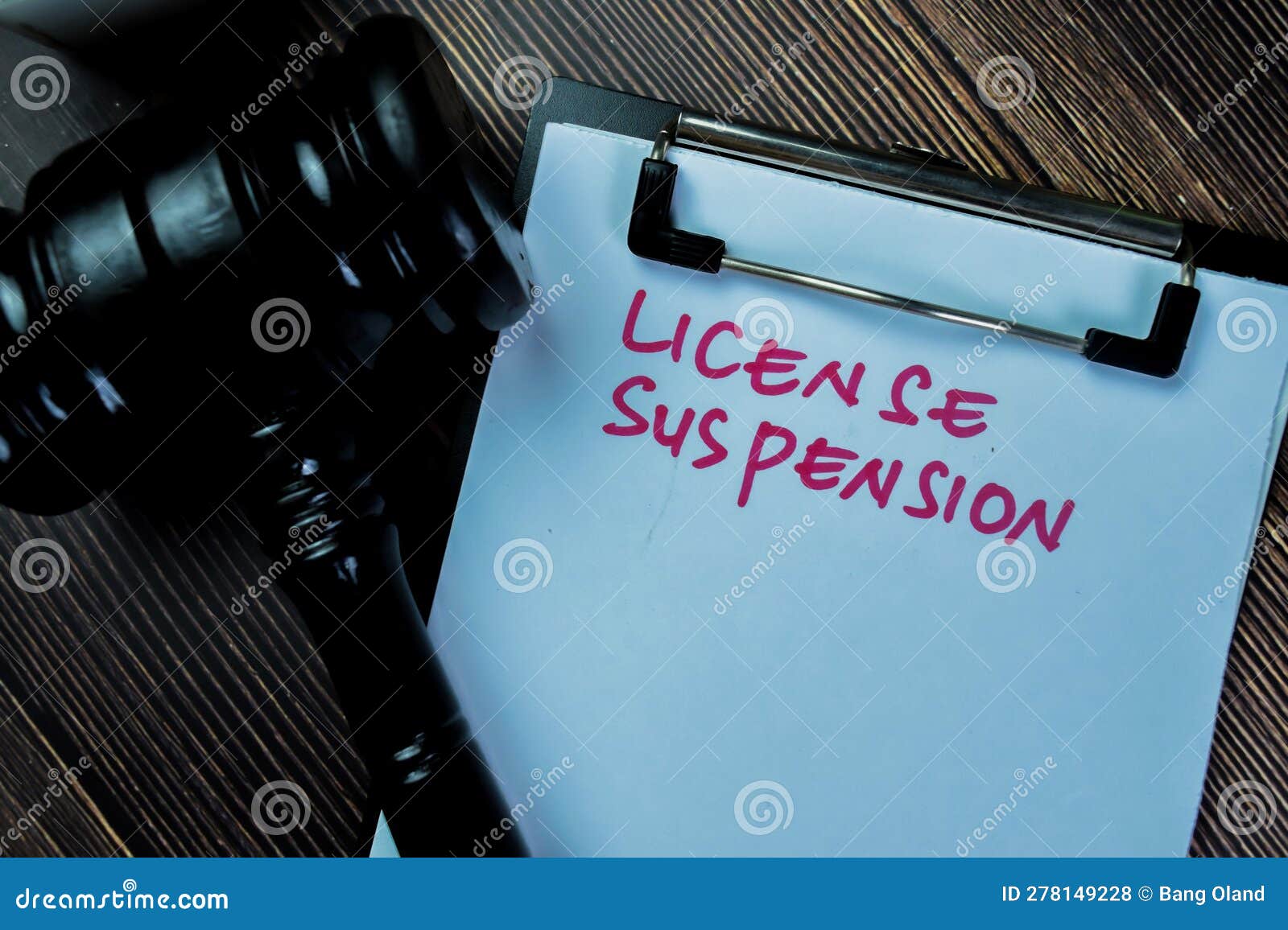 concept of license suspension write on paperwork with gavel  on wooden table