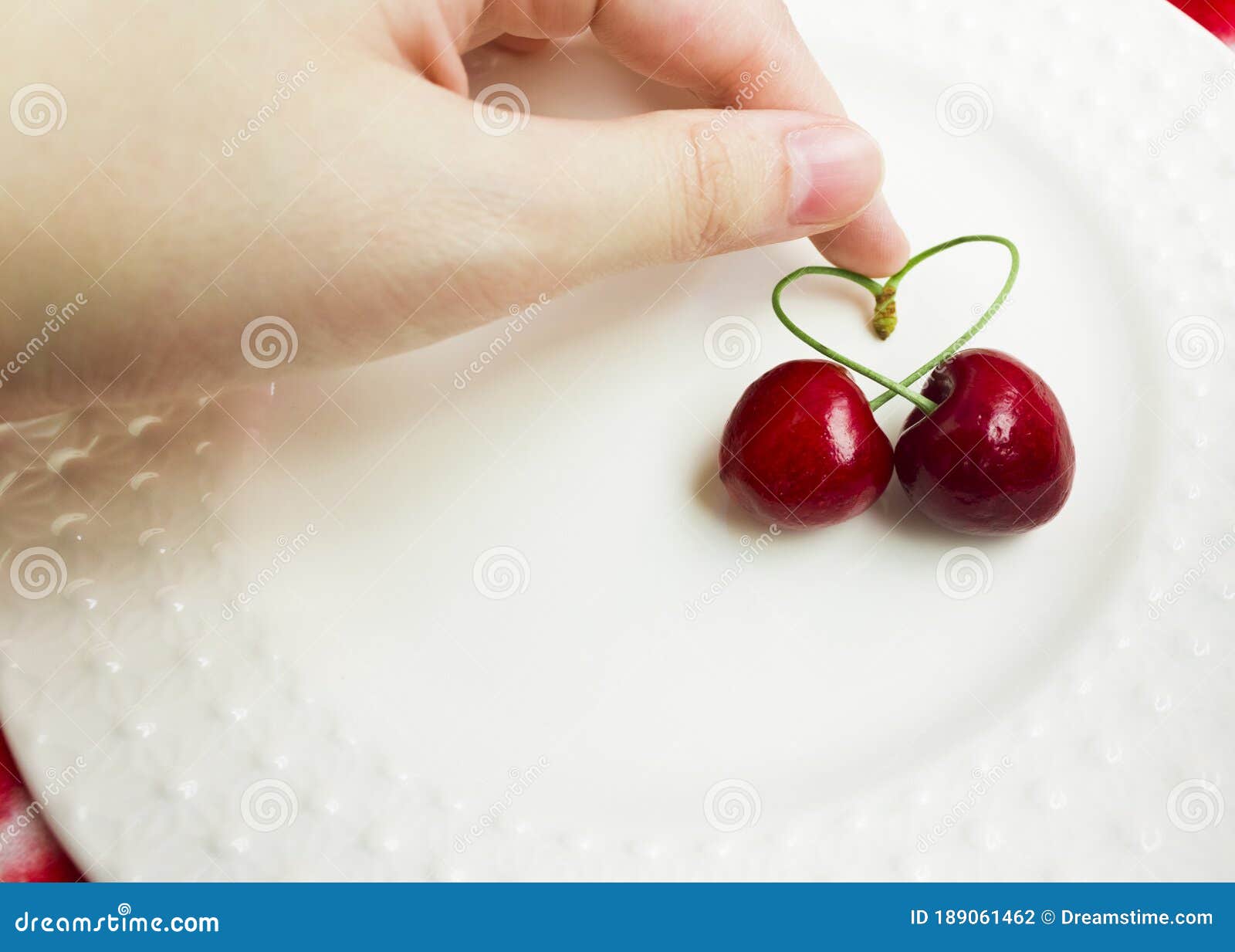 Premium Vector  Two cherries in the shape of a heart