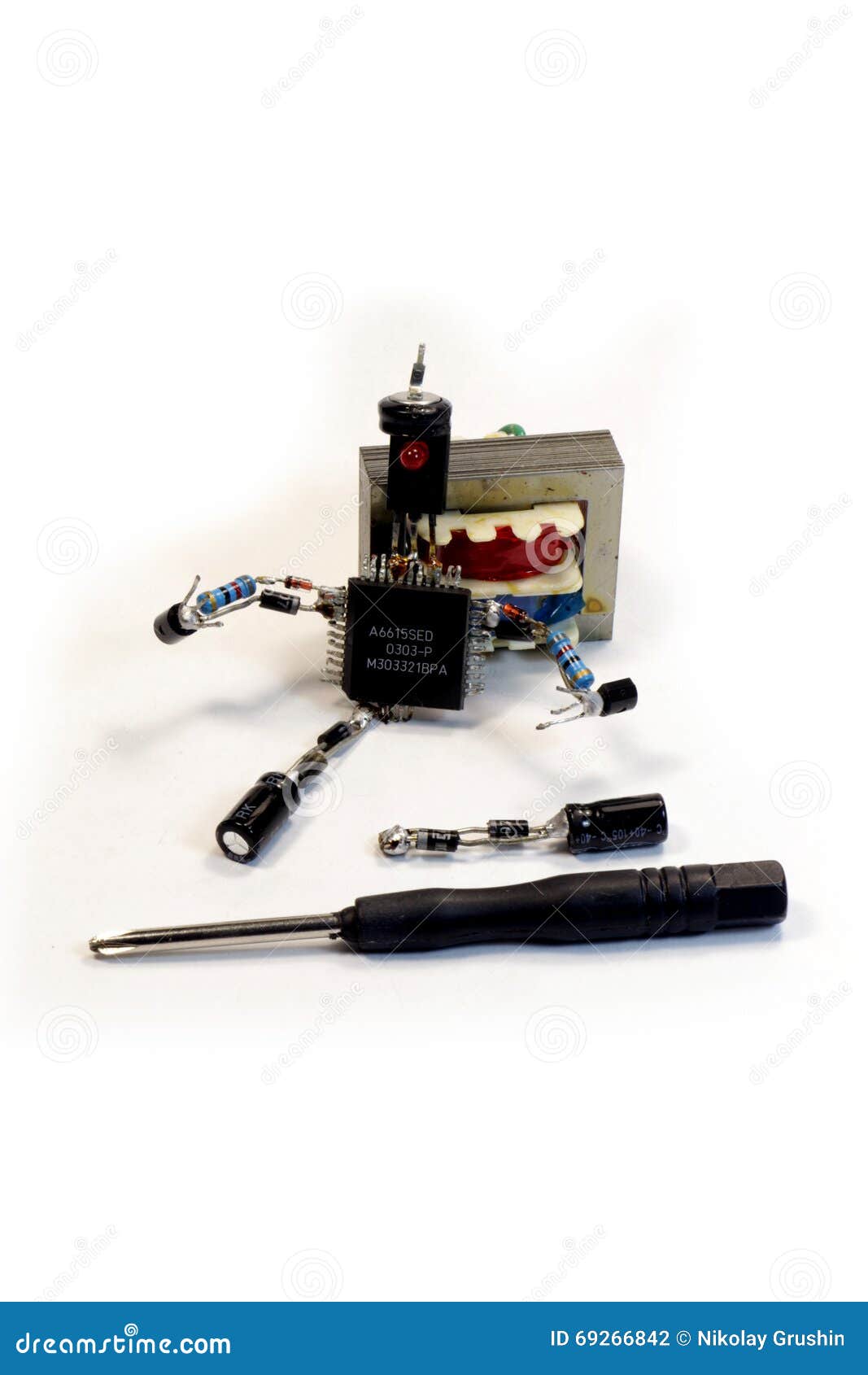 The Concept Man with a Screwdriver of Electronic Components Stock