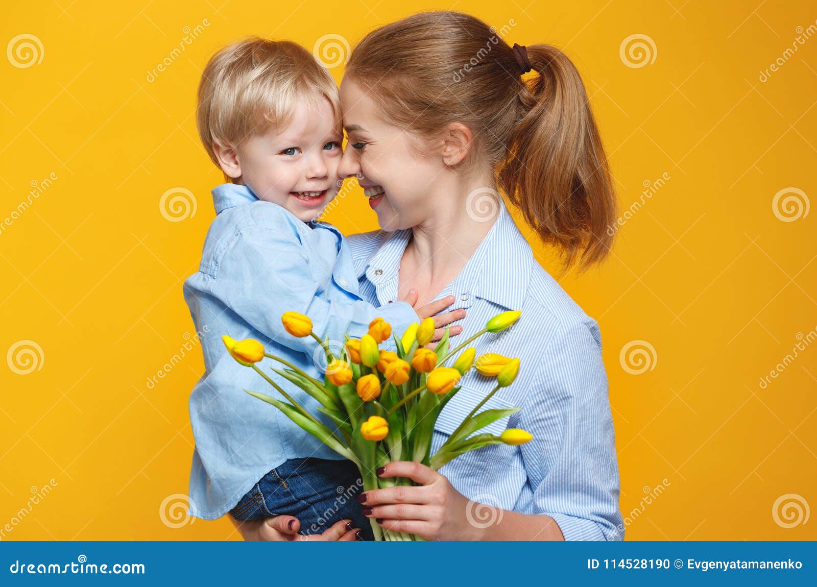 Concept of Mother`s Day. Mom and Baby Son with Flower on Colored ...