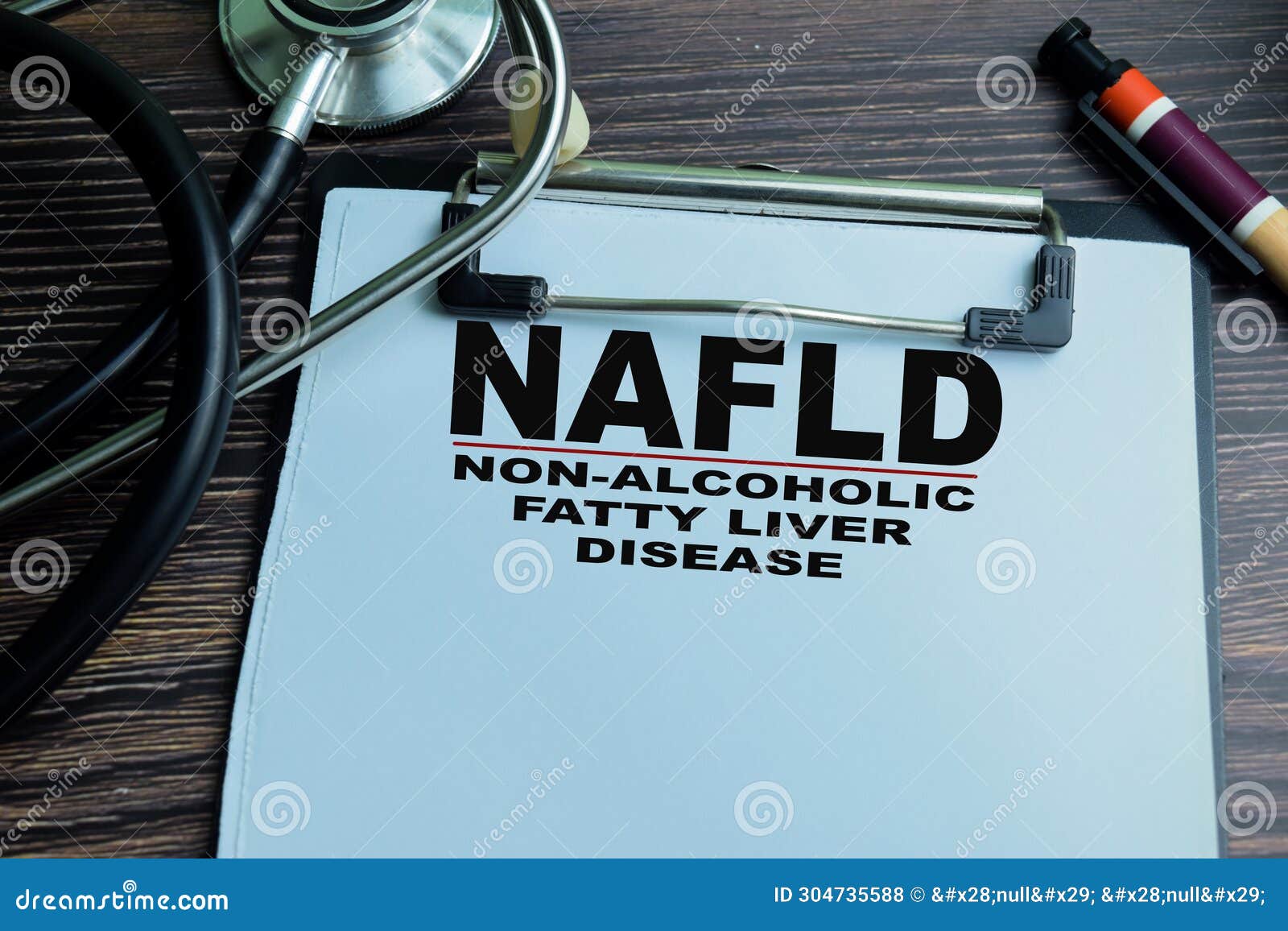 concept of nafld - non-alcoholic fatty liver disease write on paperwork  on wooden background