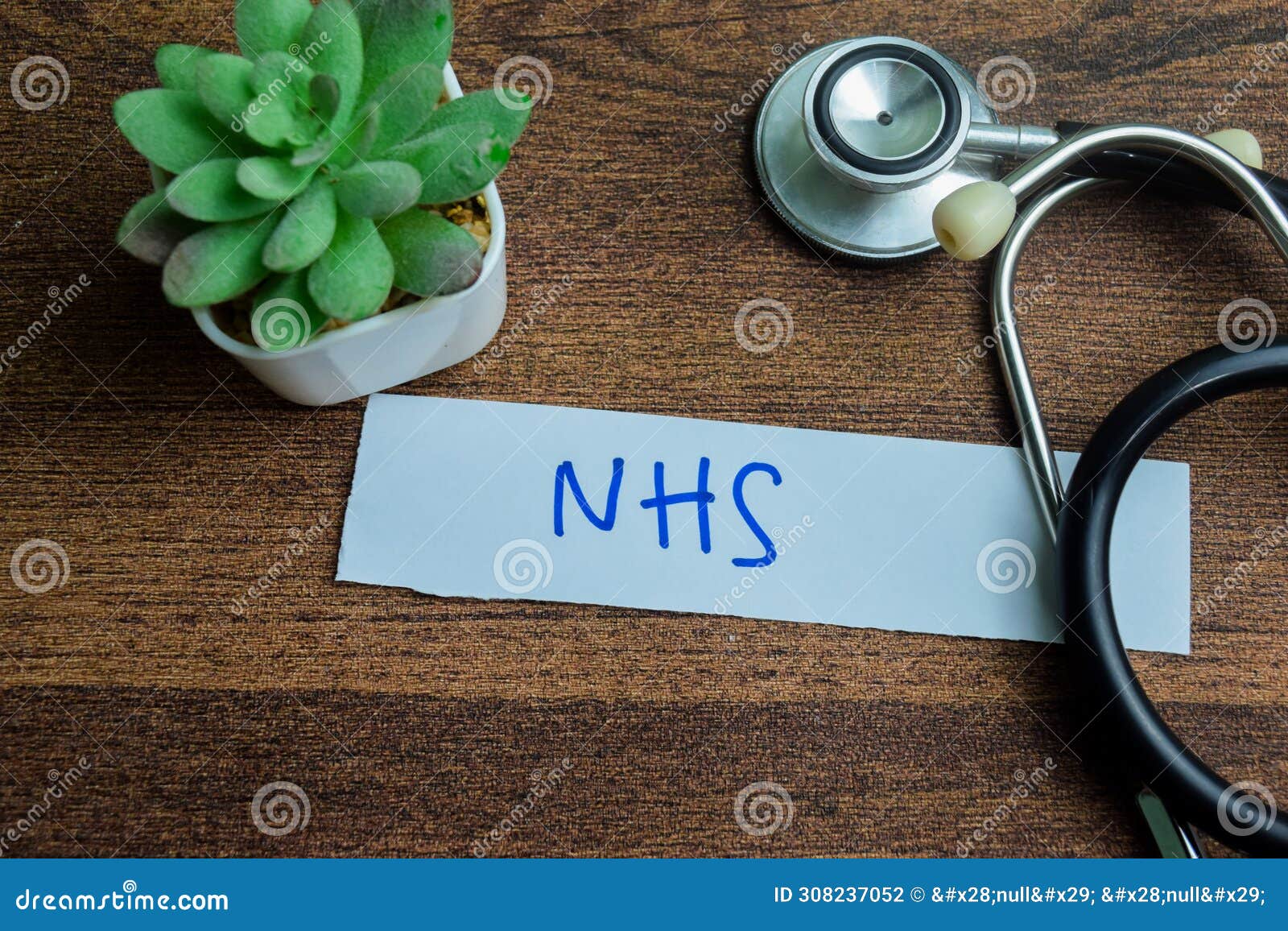 concept of nhs write on sticky notes with stethoscope  on wooden table