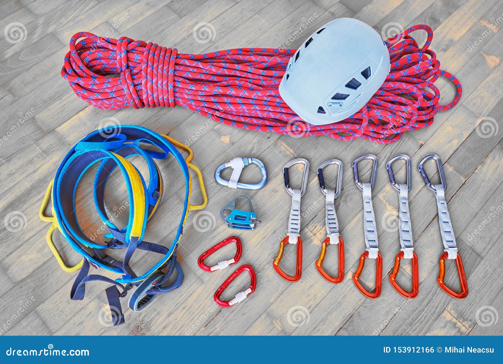 Closeup shot of a variety of carabiner hooks, rope, and other