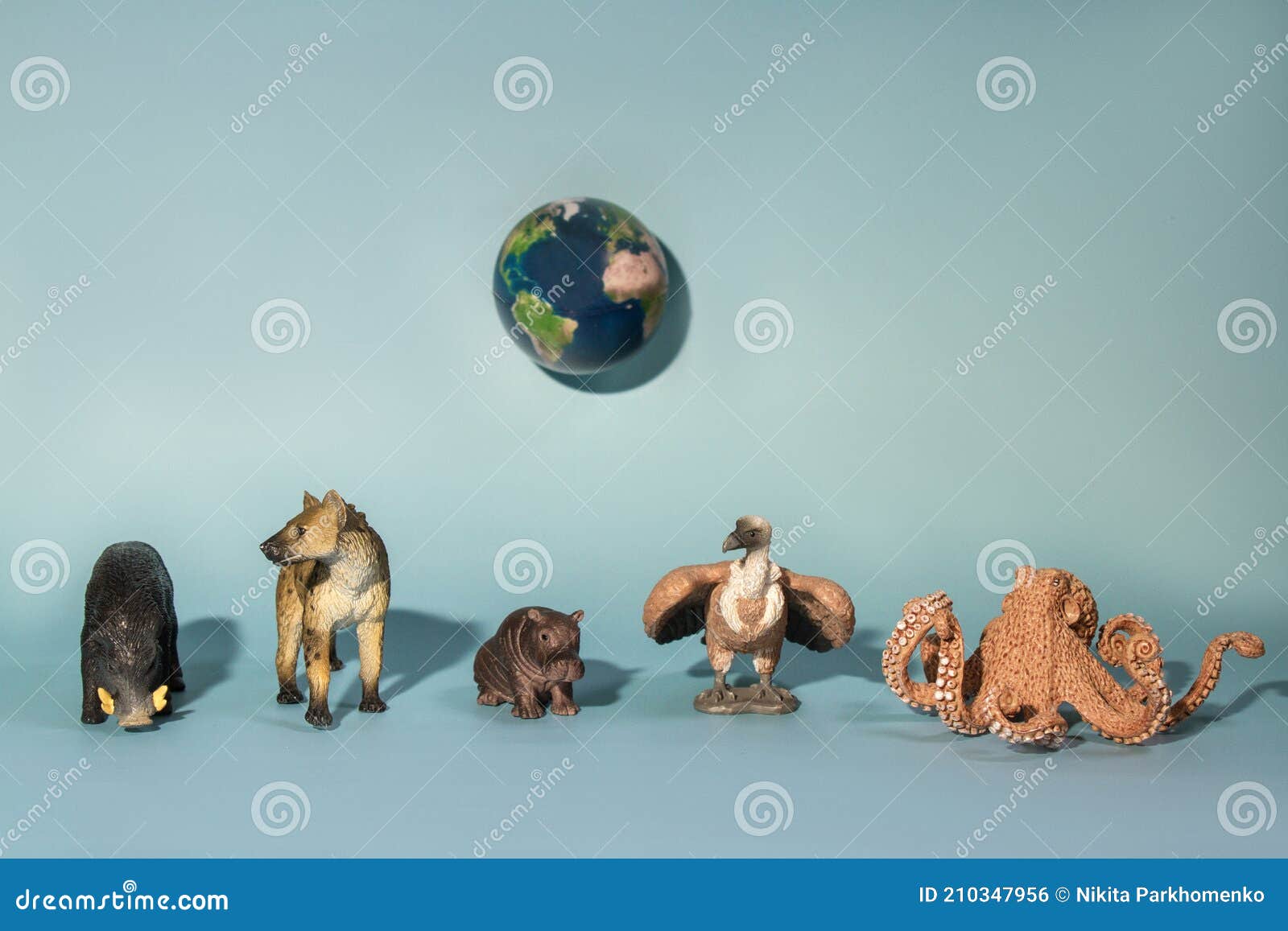 Concept Photo of World Wildlife Day. Little Toy Realistic Wild Animal and  Planet Earth on a Blue Background Stock Photo - Image of concept, globe:  210347956
