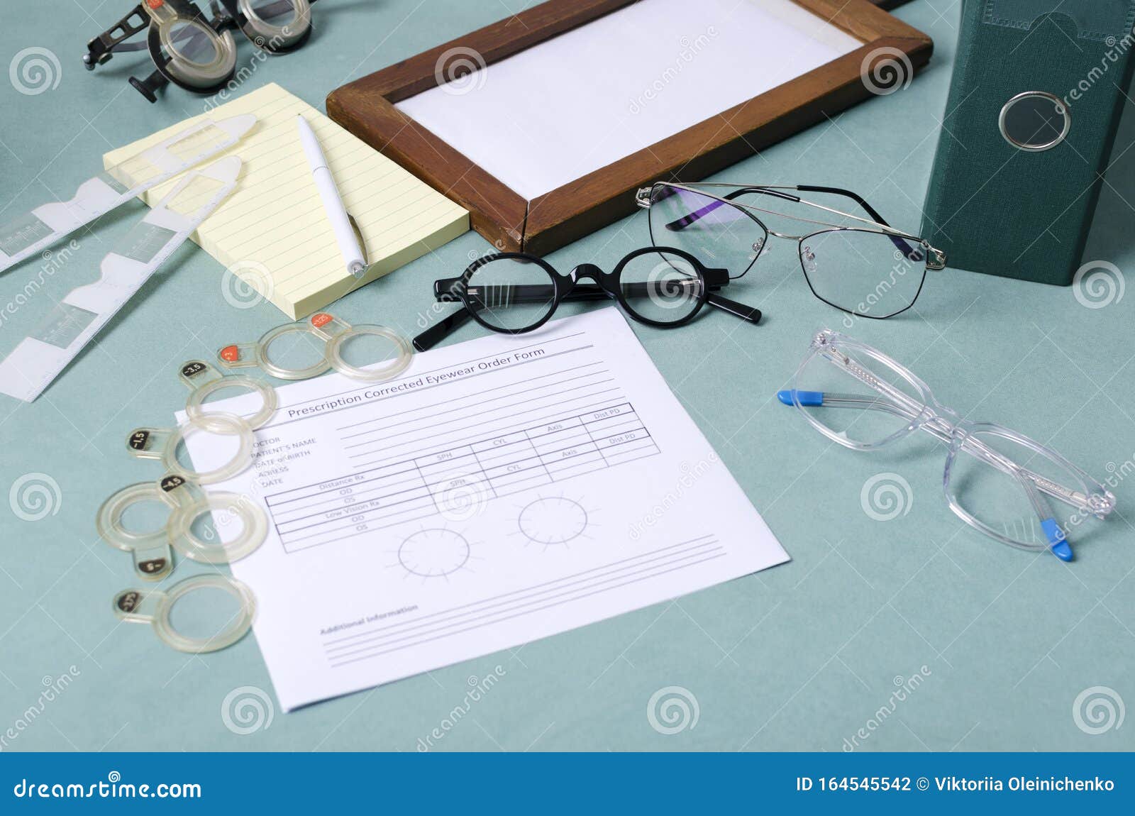 concept of ptometry and prescription for corrective spectacles. pair os eyeglasses, blank prescriprion, special instruments for di