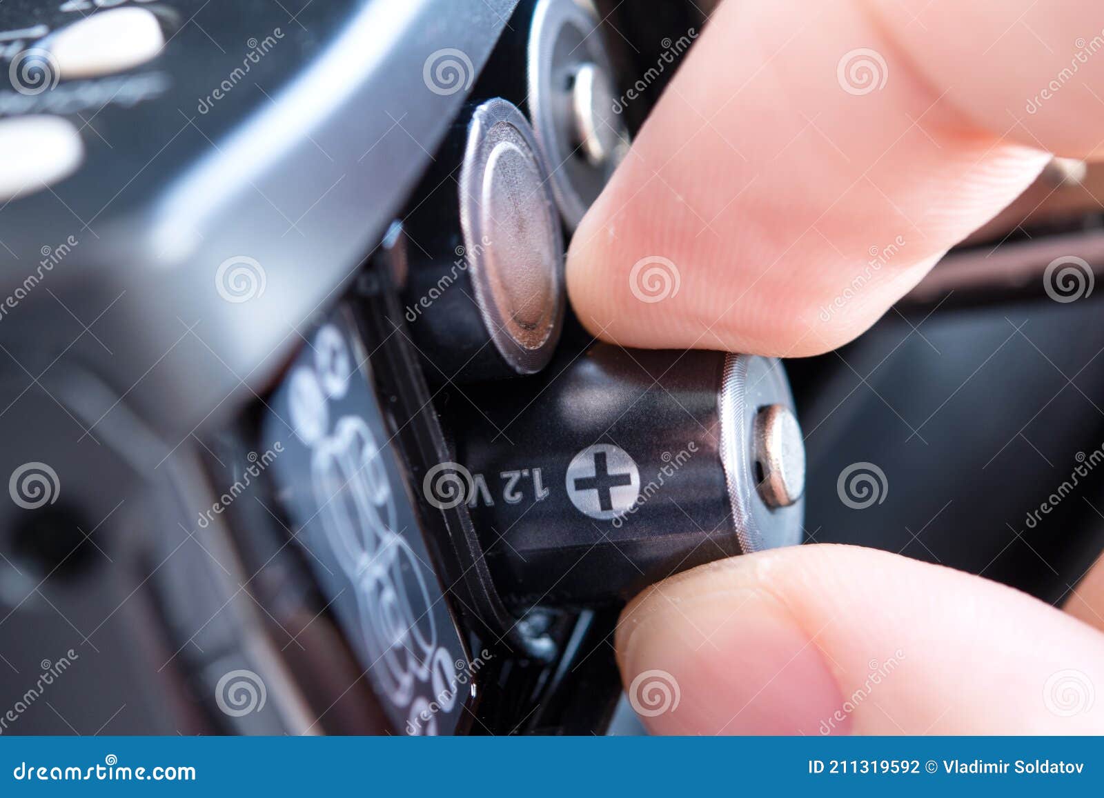 The Concept of Replacing Batteries while Traveling. AA Batteries Stock