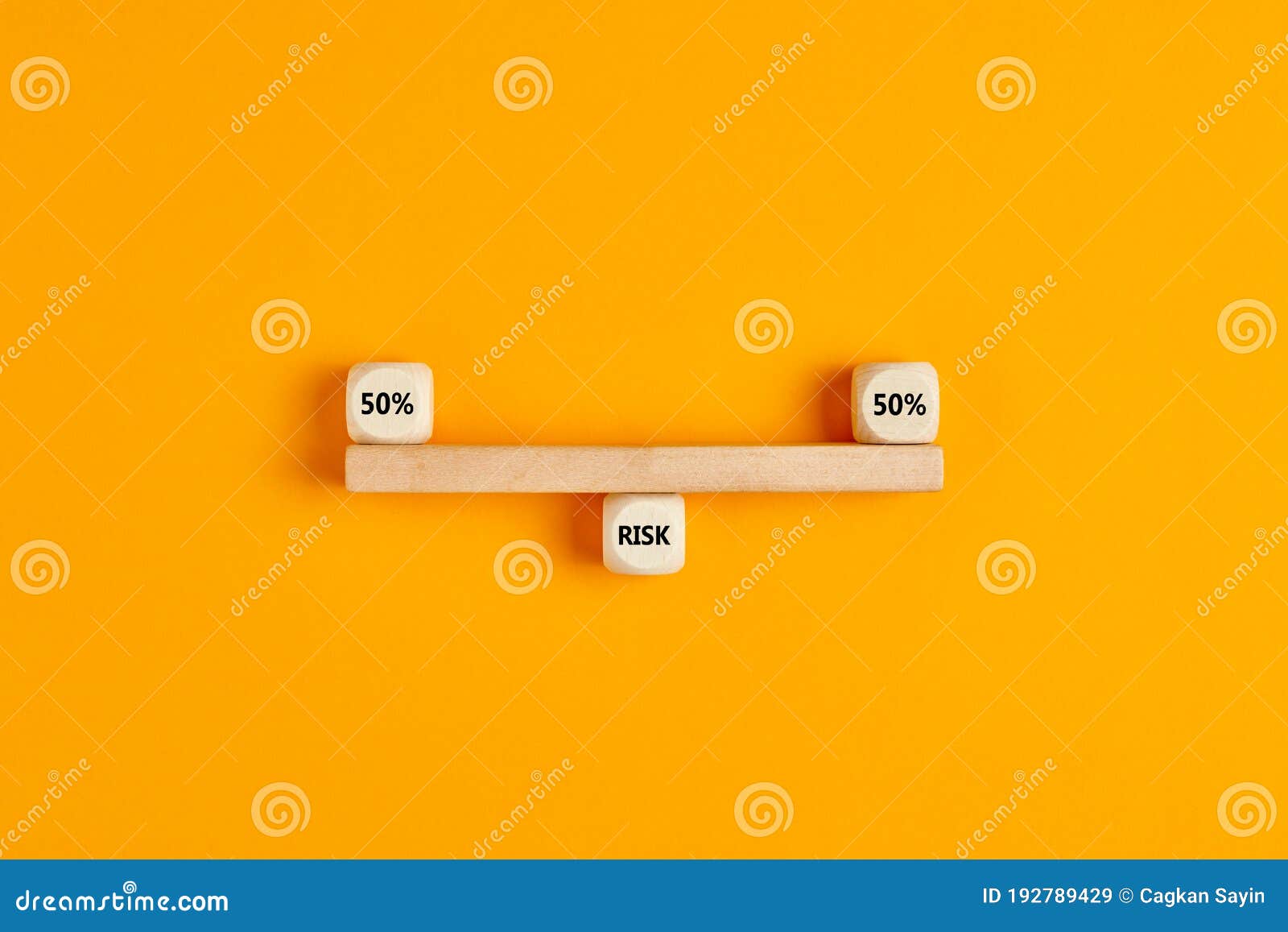 concept of risk analysis or risk sharing in business. wooden blocks ed as a seesaw balanced with the risk distribution of 50