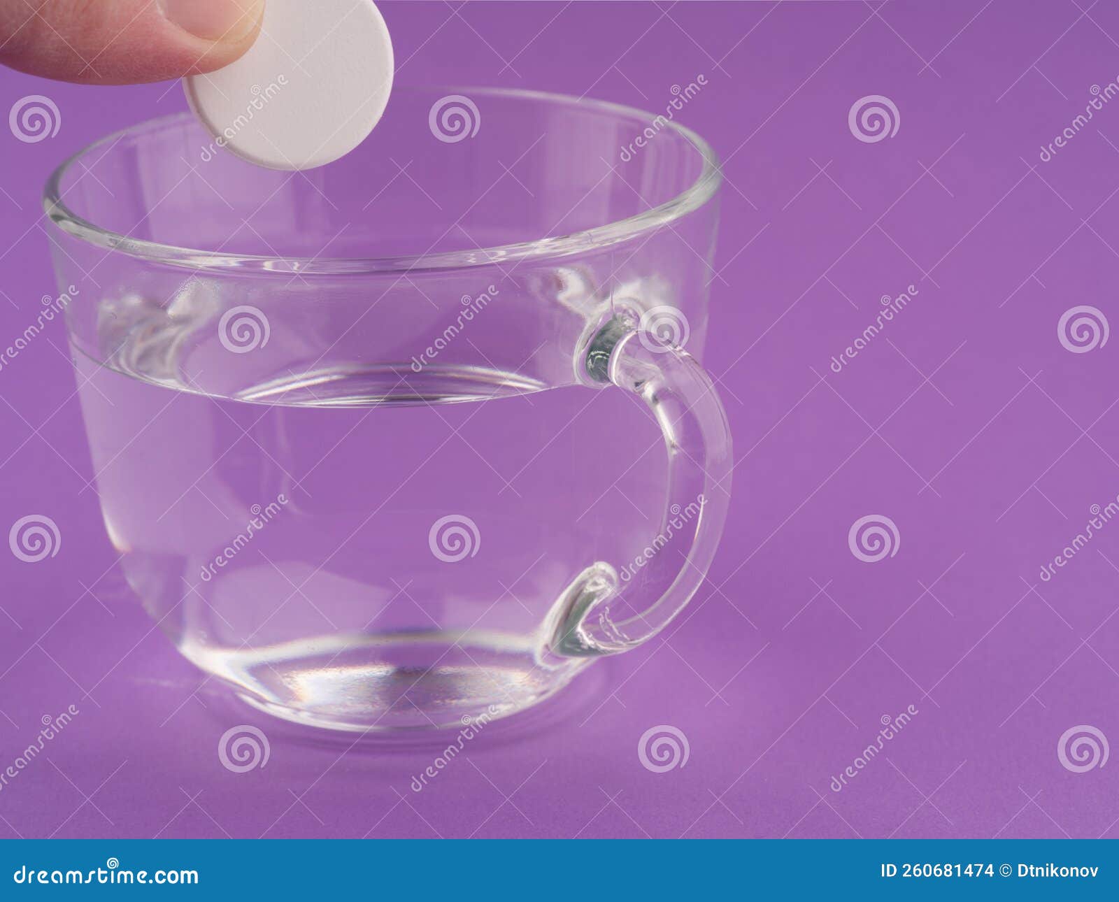 The Concept of Taking Medications. a Cup and a Pill is Put in it Stock