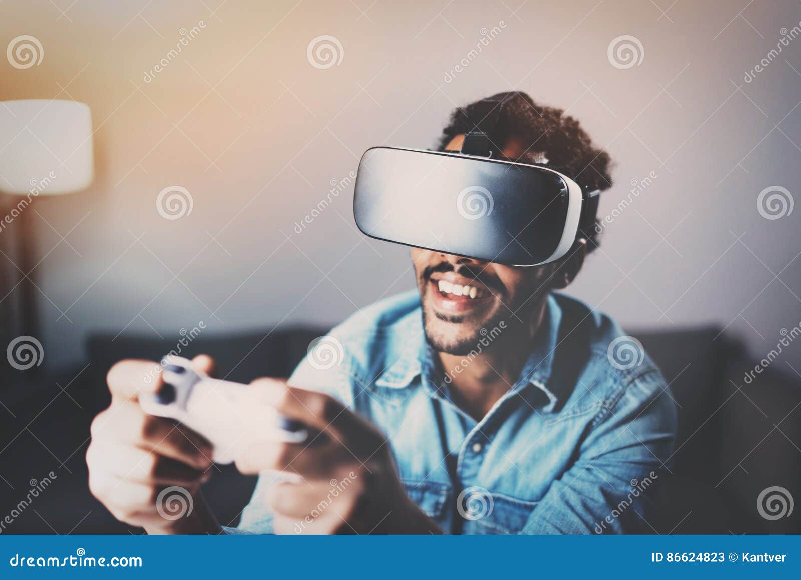 concept of technology,gaming,entertainment and people.african man playing virtual reality glasses video game while