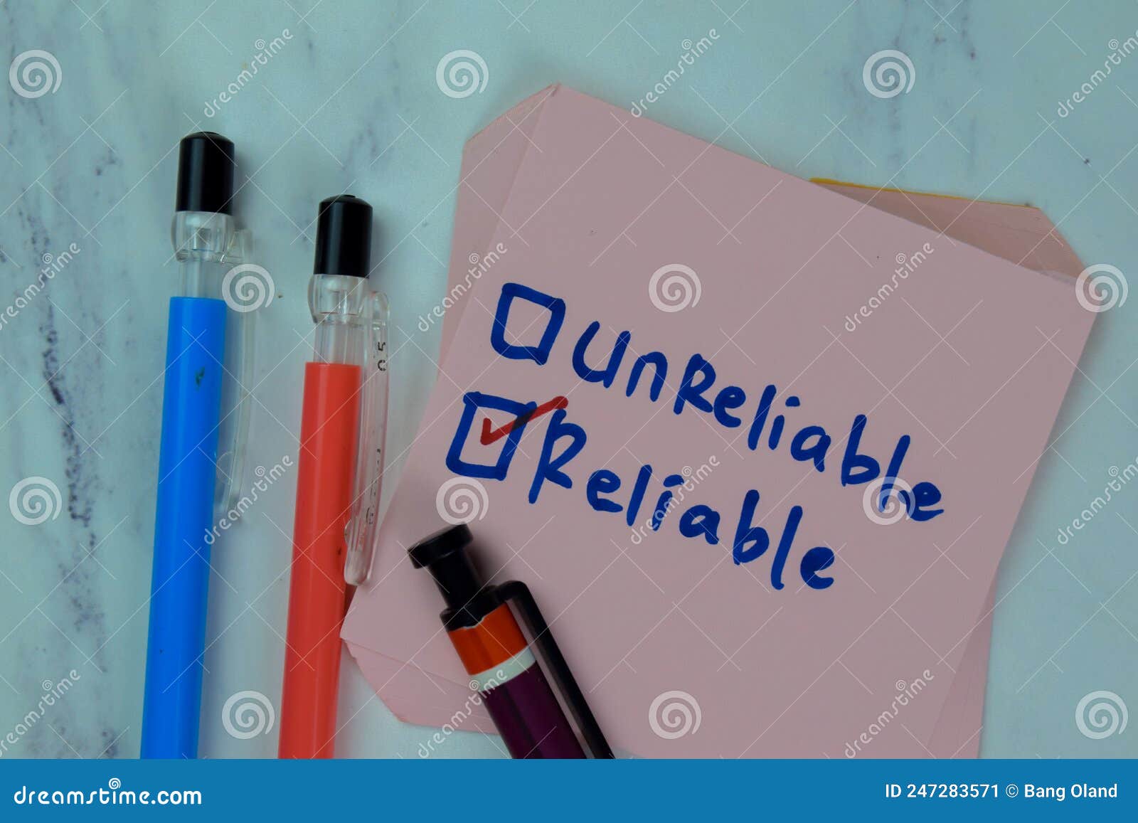 concept of unreliable or reliable write on sticky notes  on wooden table
