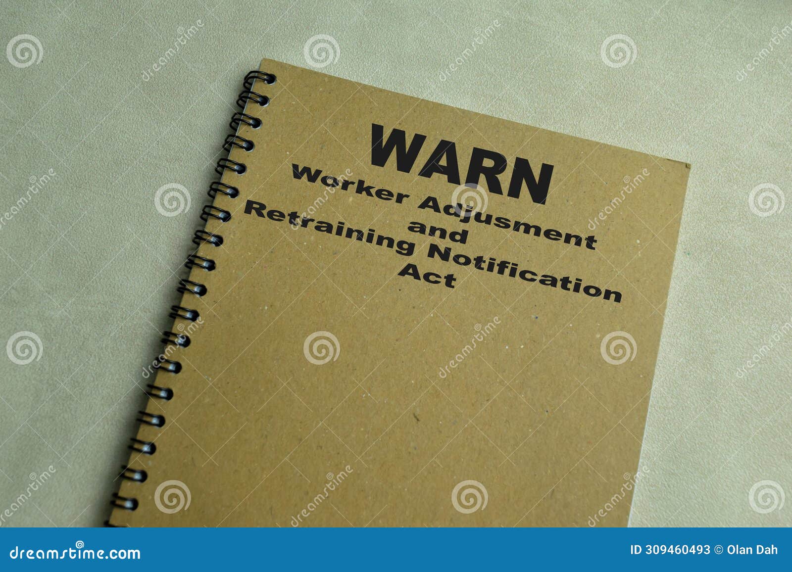 concept of warn - worker adjusment and retraining notification act write on book  on wooden table