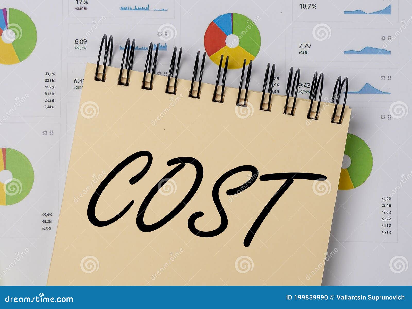 Concept Word Cost on Office Table Over Analytical Diagrams Stock Photo