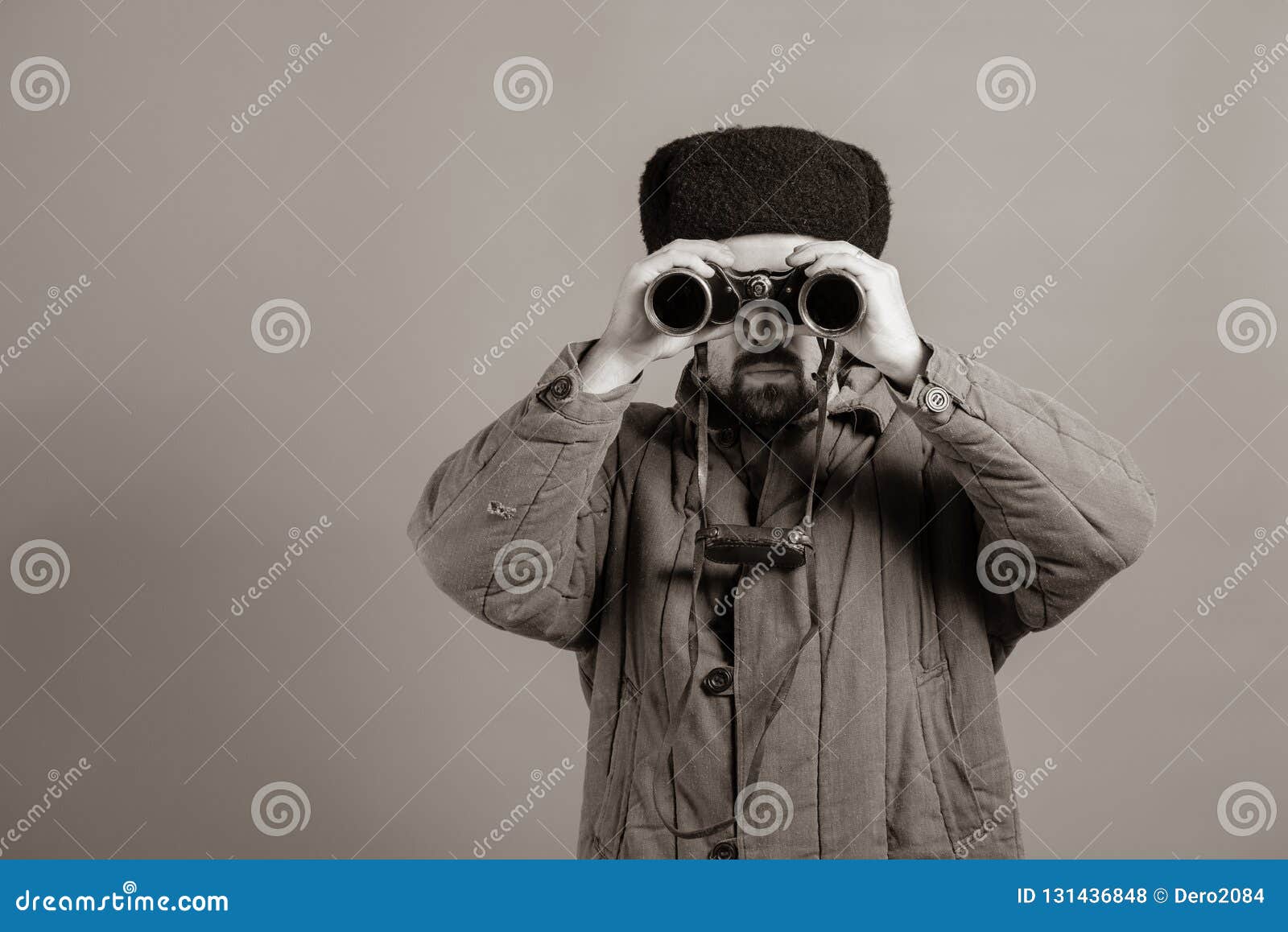 conception - soldier on the post. observation with binoculars, uniforms of the great patriotic war, sepia effect