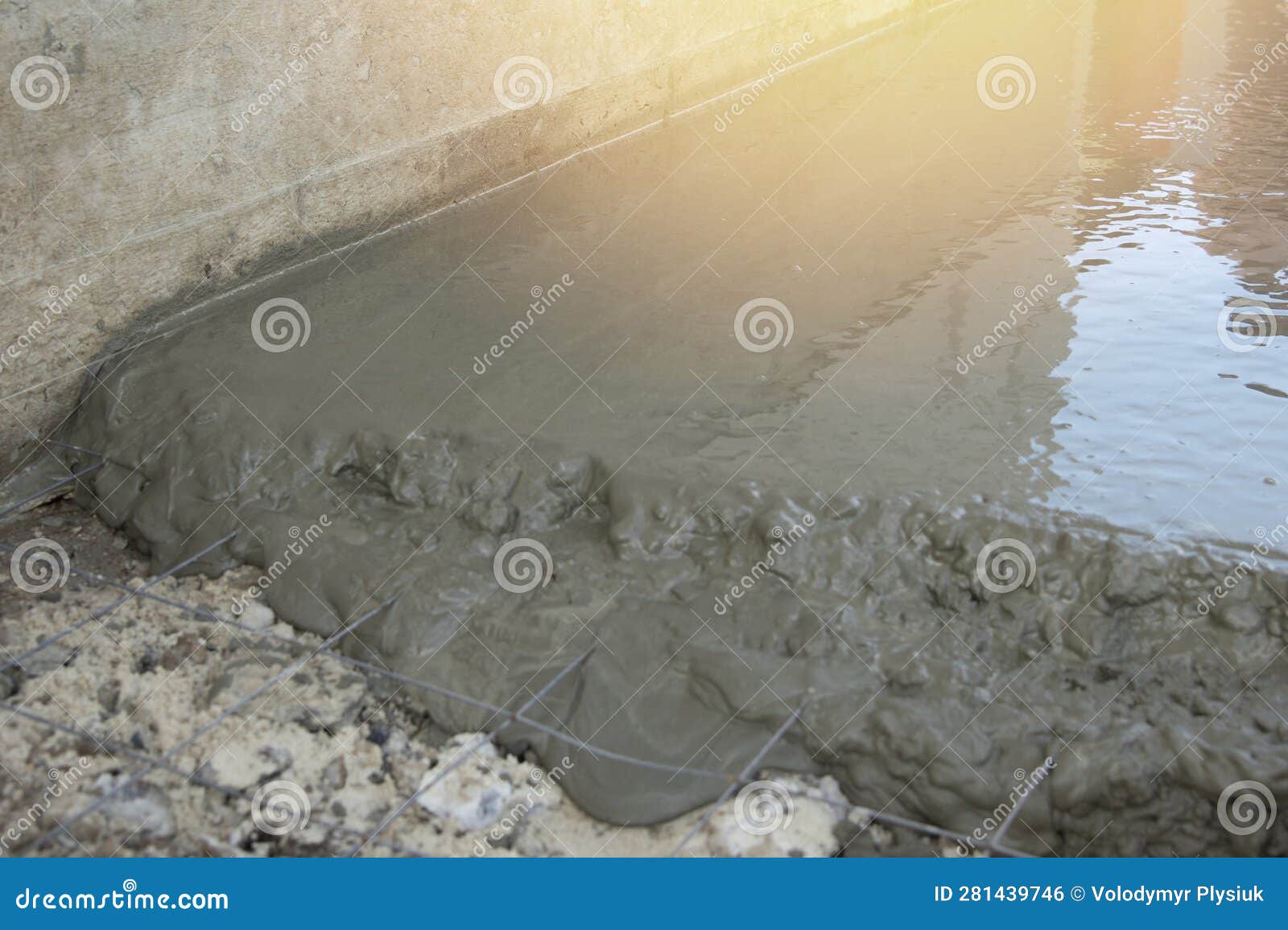 Concepts of Pouring Concrete Screed Over Reinforcing Mesh Stock Photo