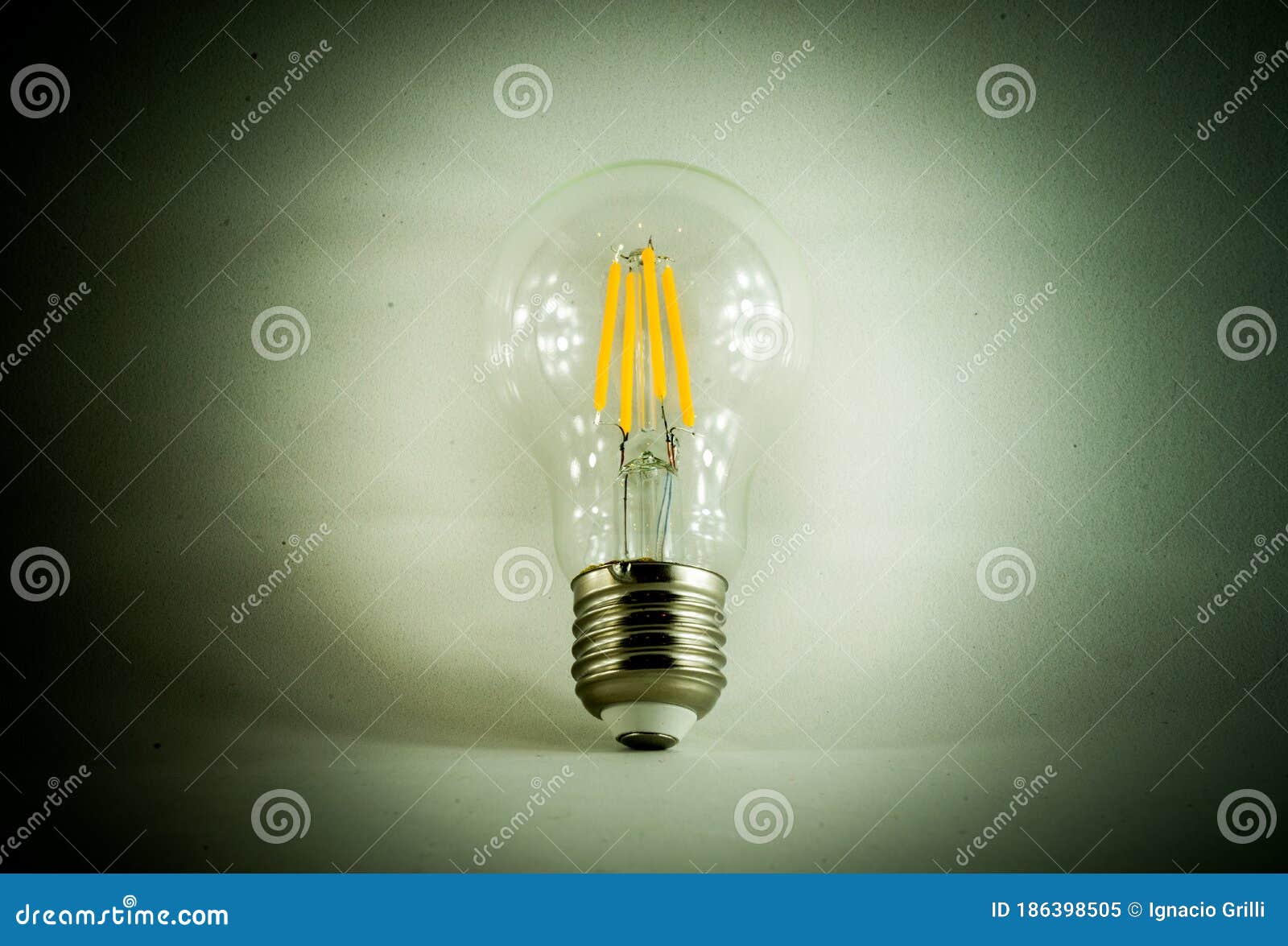 conceptual light bulb in minimalist white background